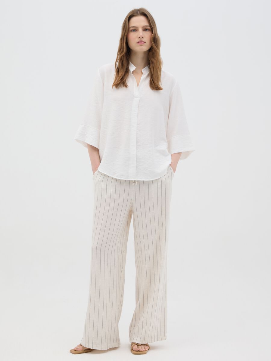 Women's beige regular fit palazzo trousers in lyocell-linen blend_0