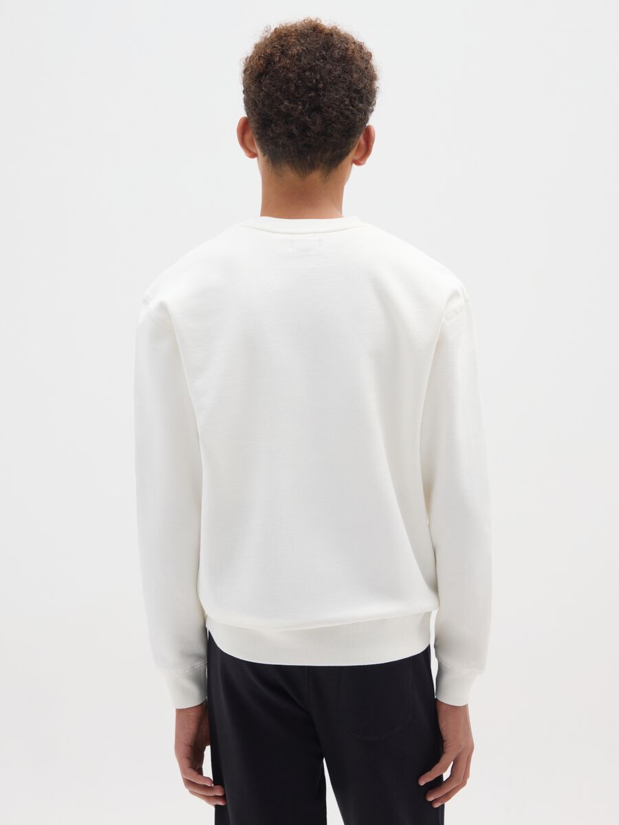 Boy's white sweatshirt with print in pure cotton oversized fit_1