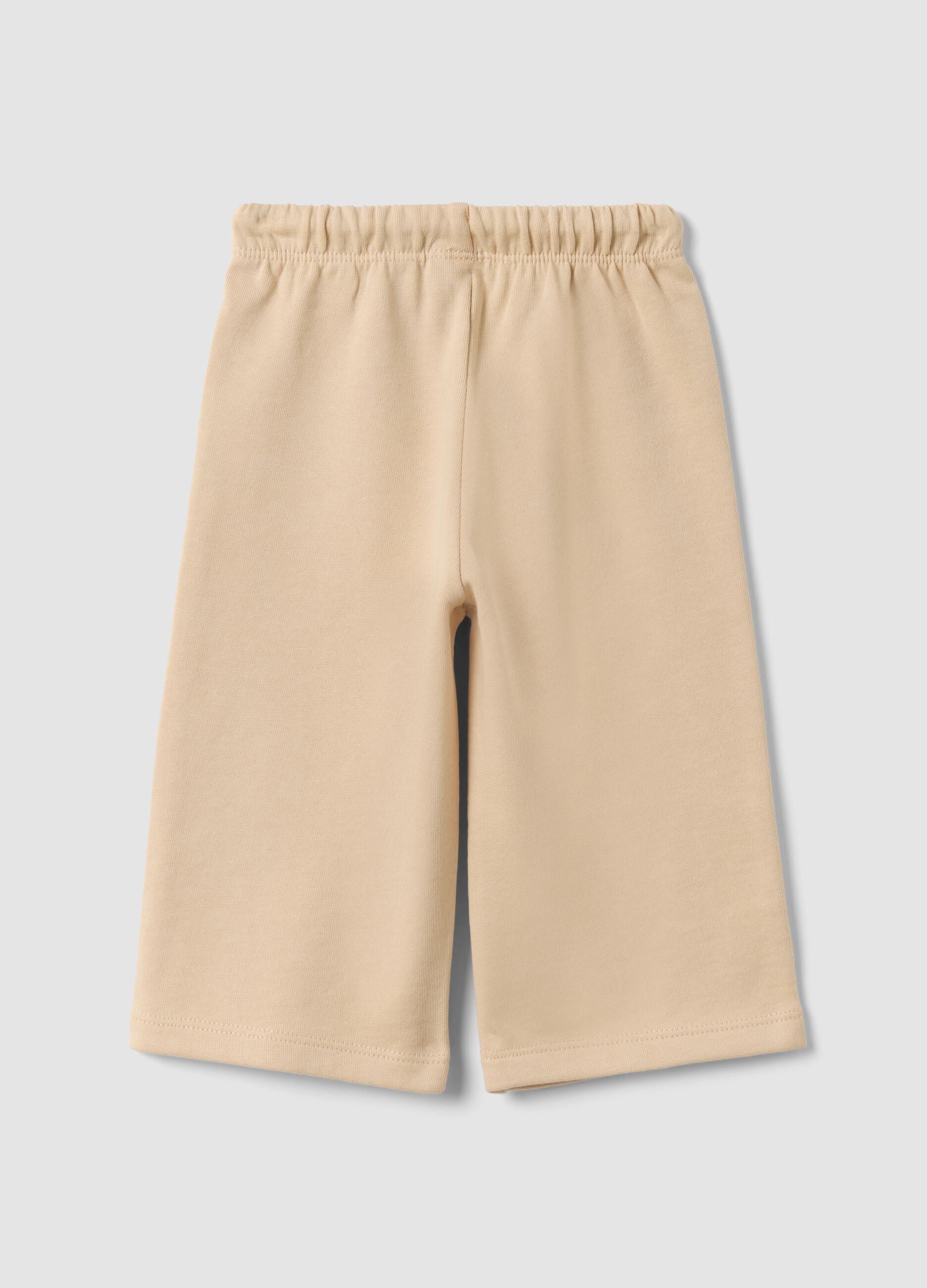 Pantaloni beige in puro cotone con vita elastica e stampa per bimba