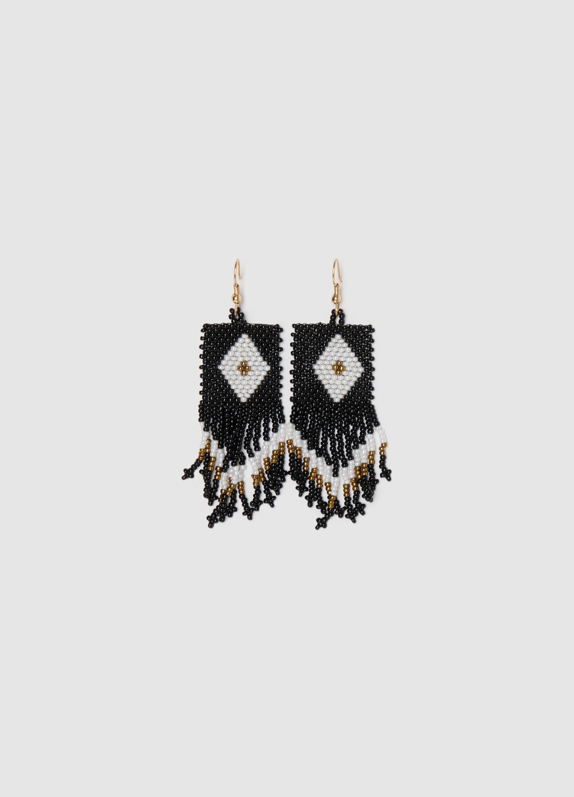 Black and white pendant earrings with beads and fringing
