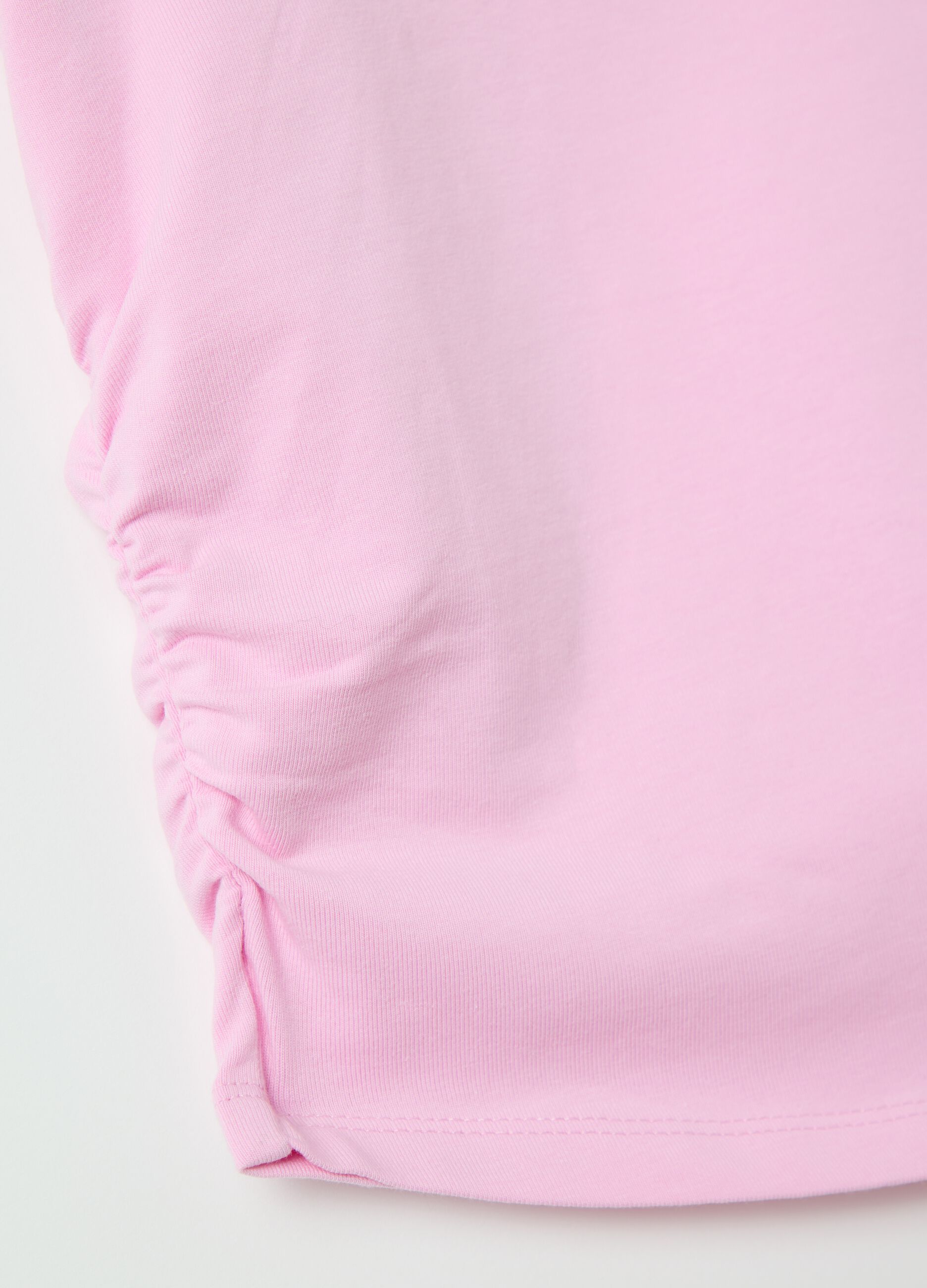 Pink slim-fit T-shirt with gathering on the side
