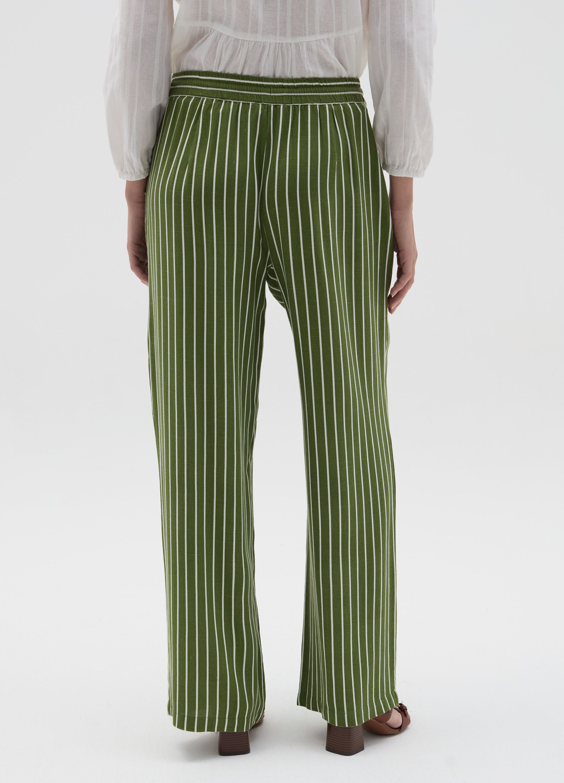 Striped green palazzo trousers in viscose and linen