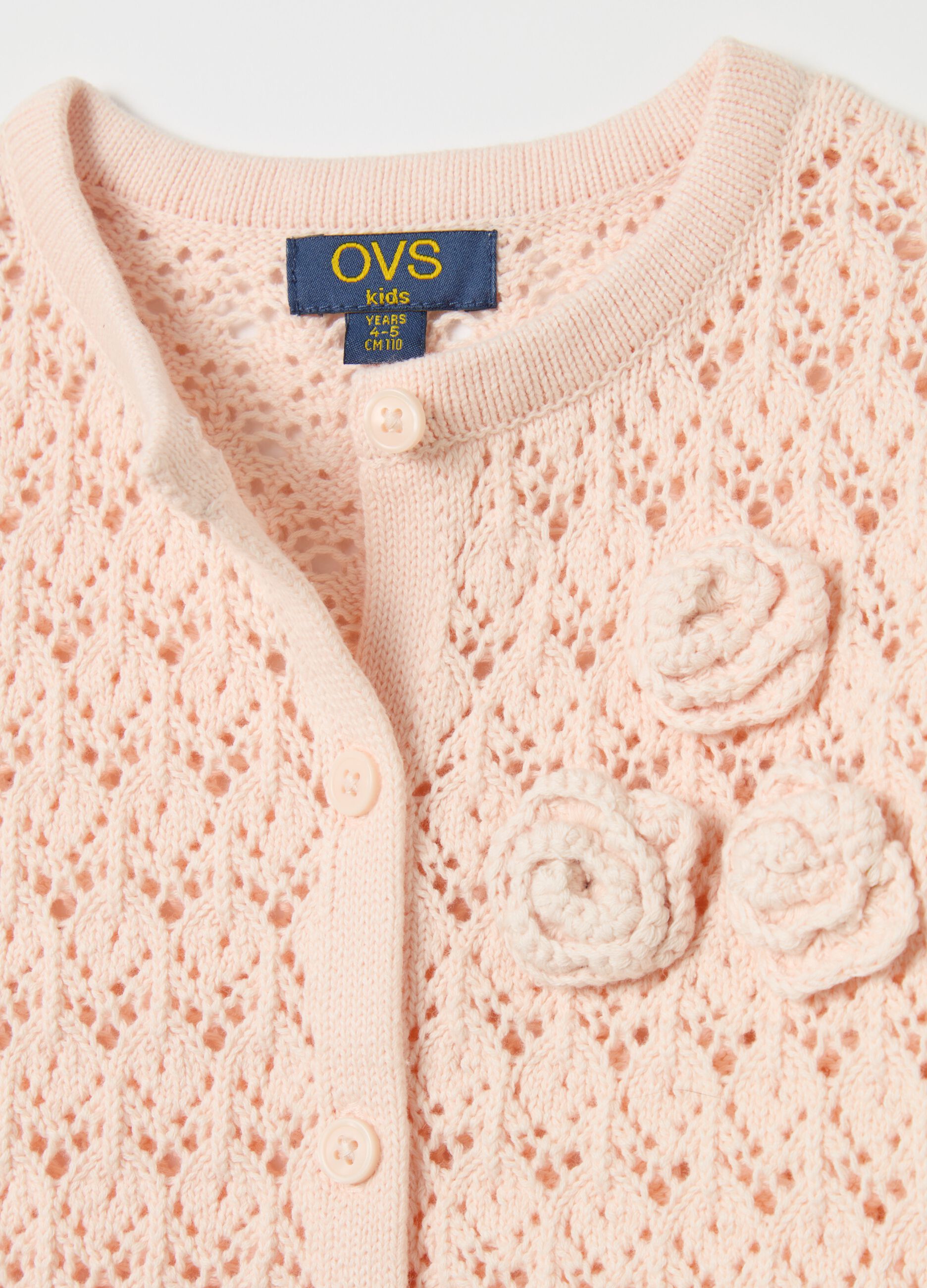 Cardigan with openwork weave and crochet flowers