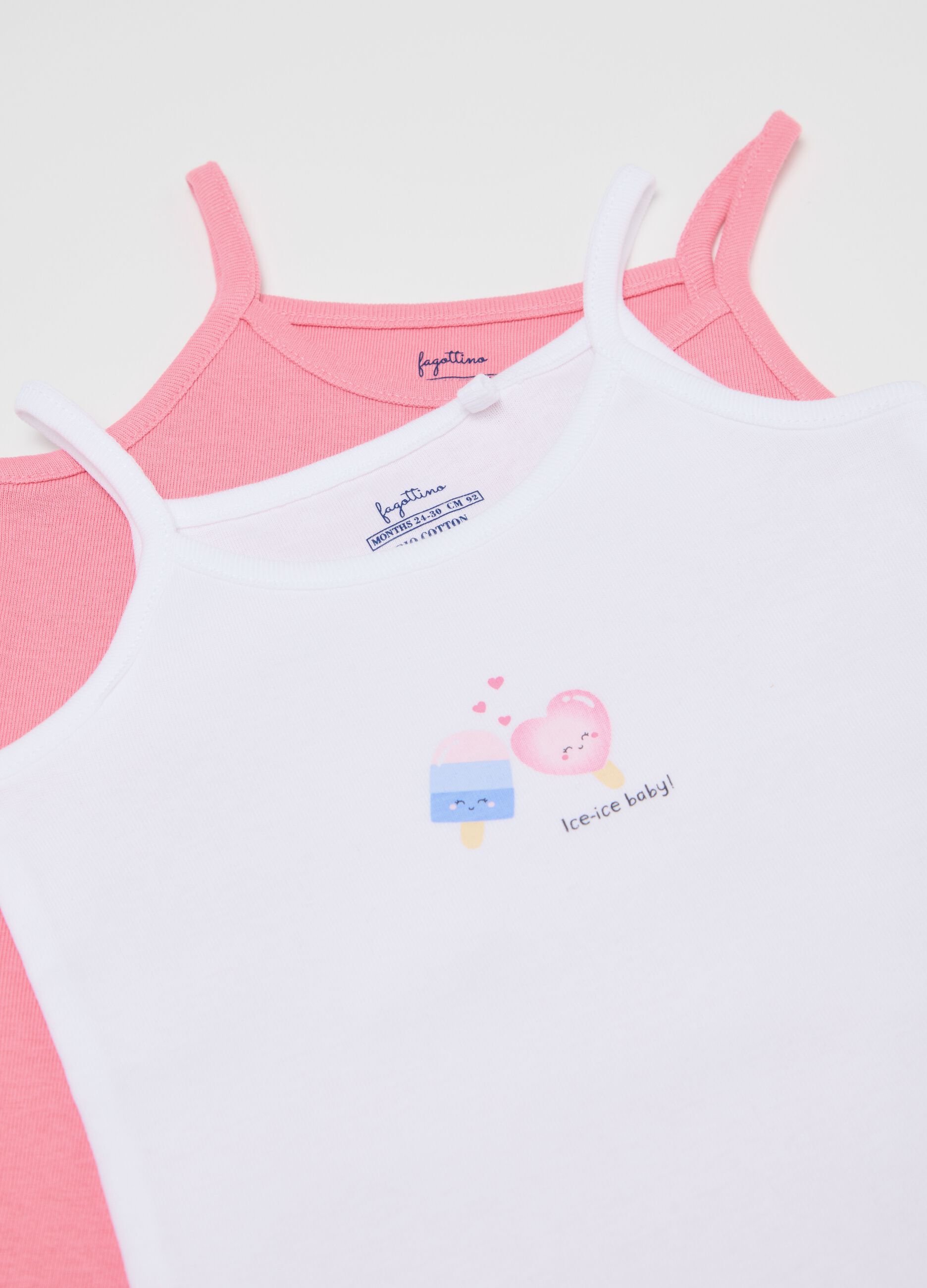 Three-pack sleeveless pink and white bodysuits in organic cotton with print