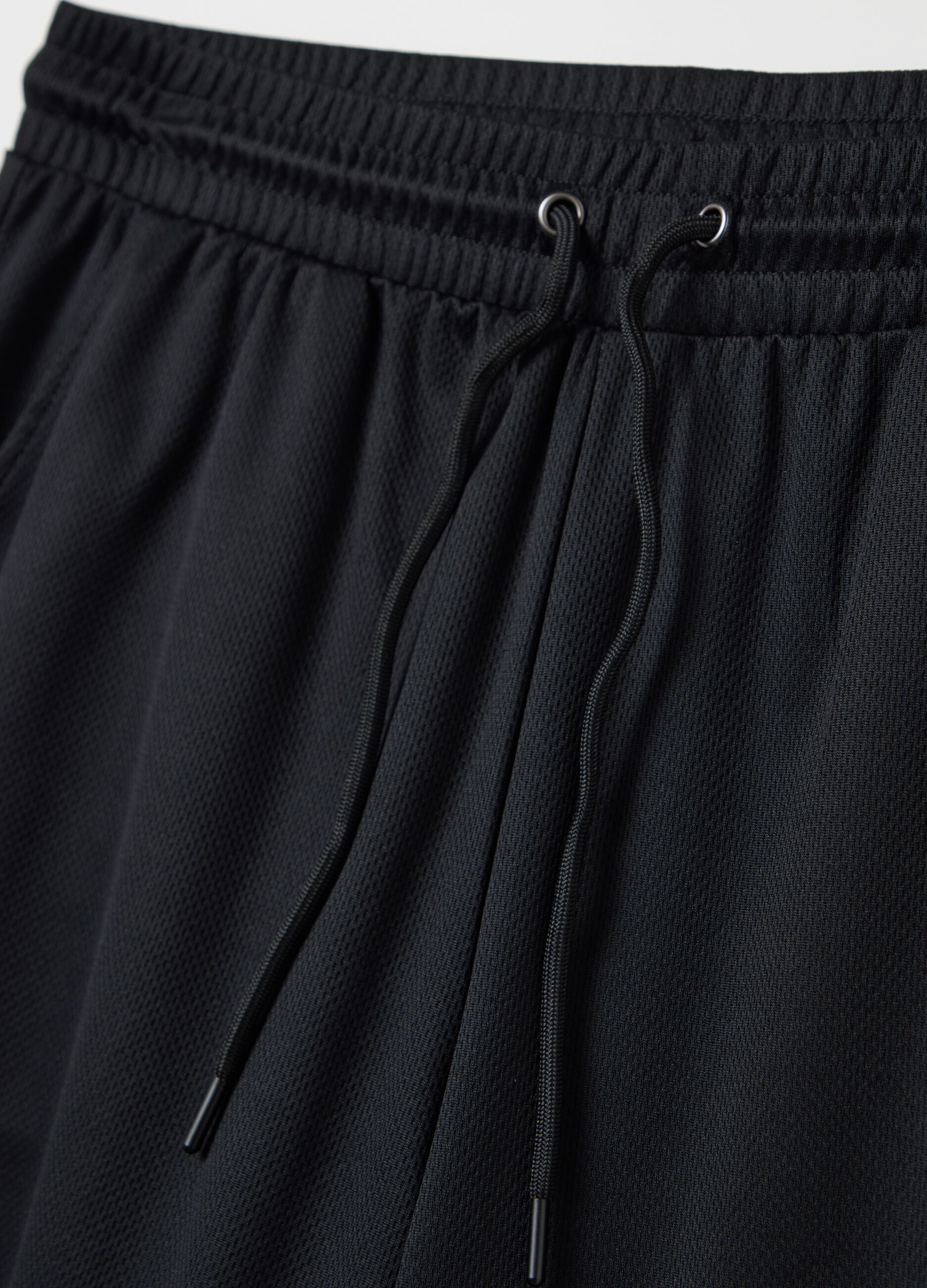 Black Bermuda joggers with NFC print