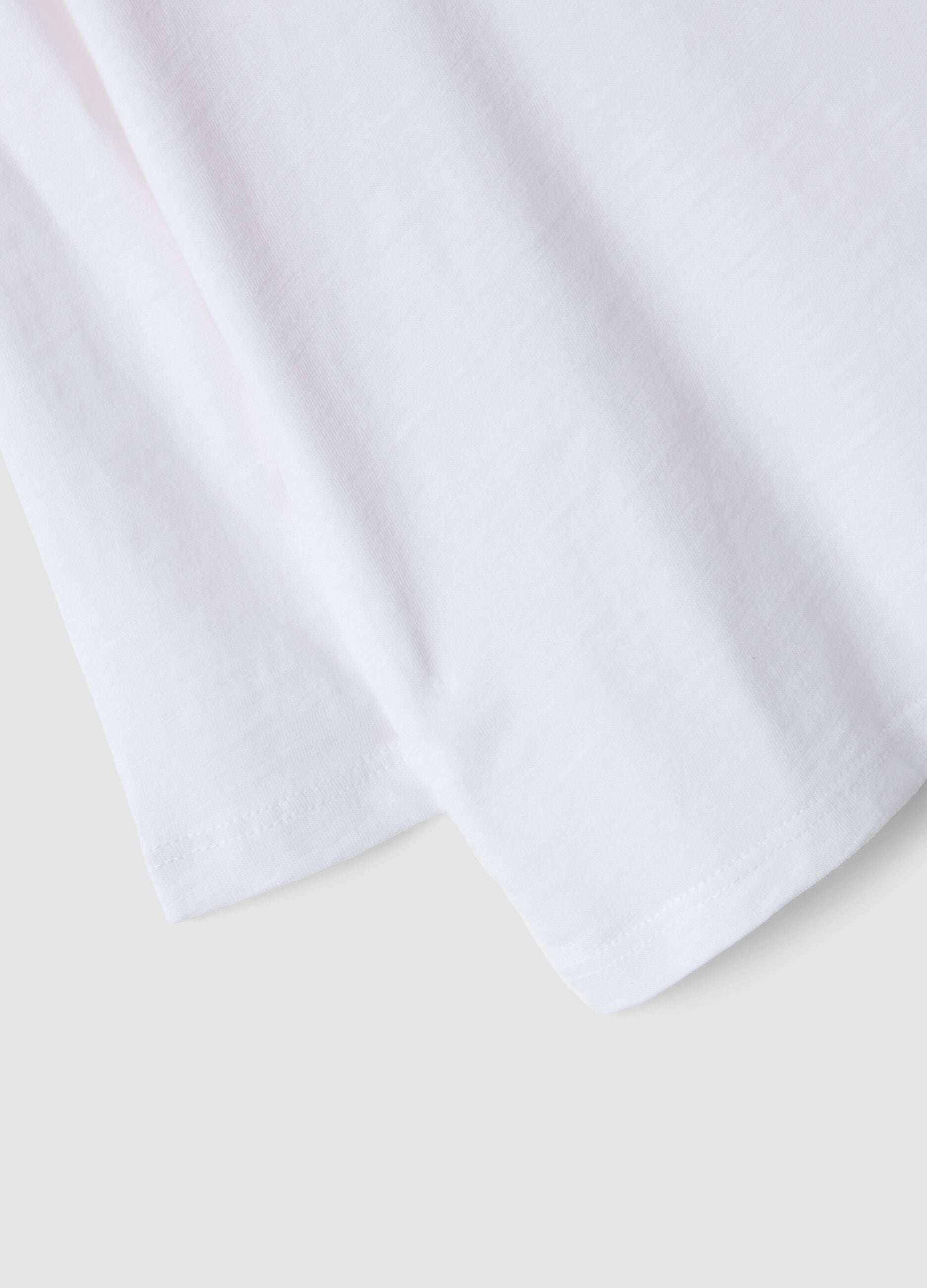 White oversized pure organic cotton T-shirt with chest pocket for boys