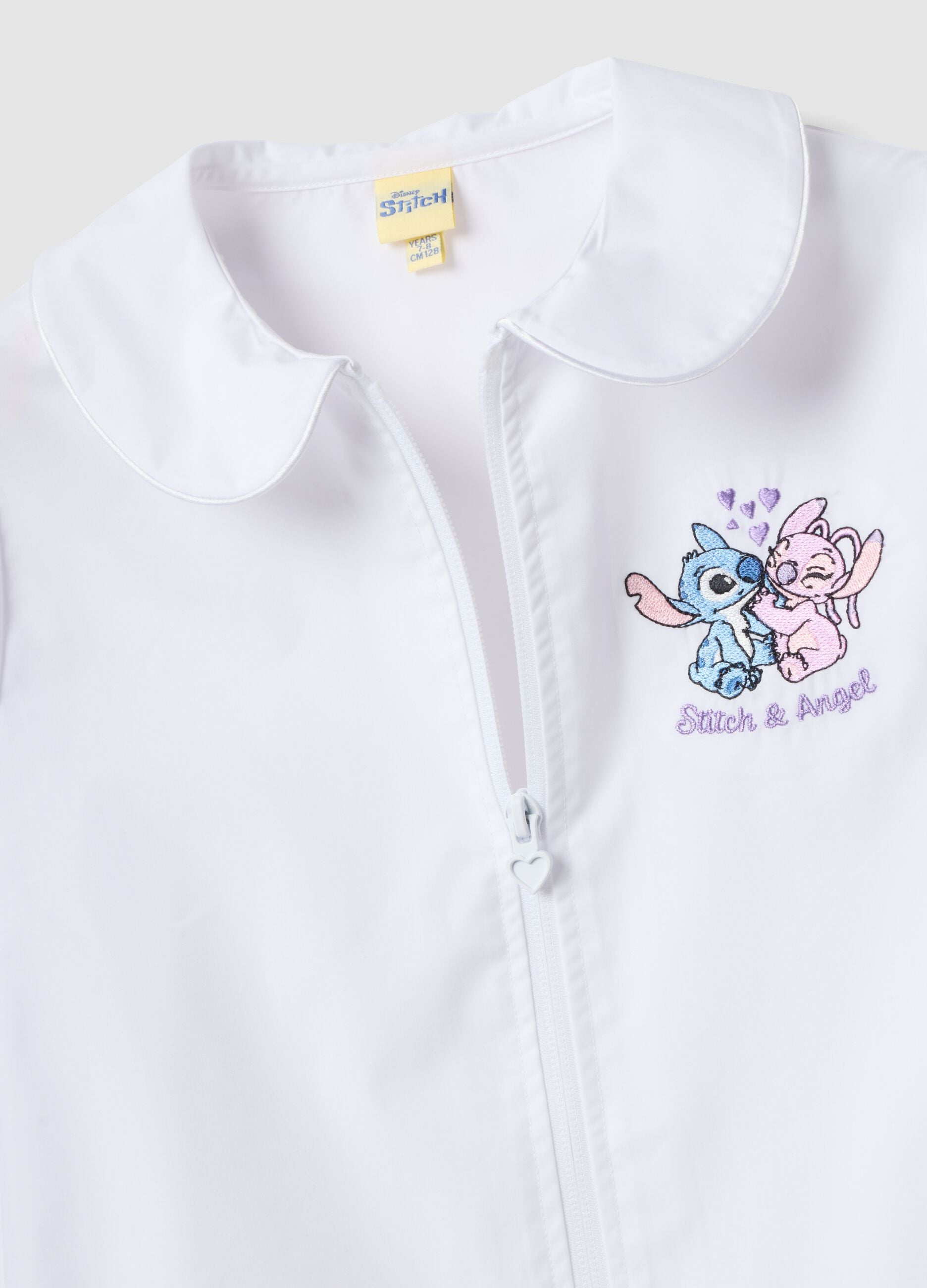 White girls&rsquo; school apron with zip and Stitch embroidery