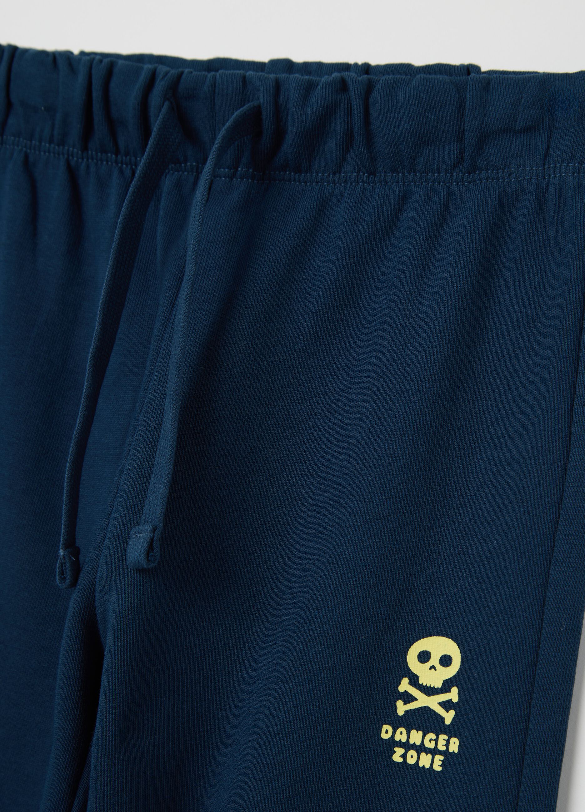 Blue cotton joggers with drawstring and print