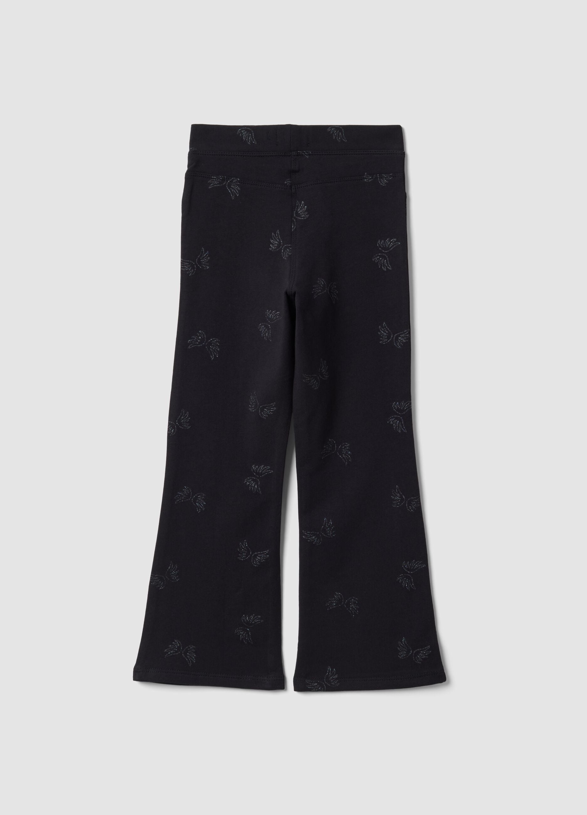 Treggings flare neri in cotone organico elasticizzato con ali glitterate