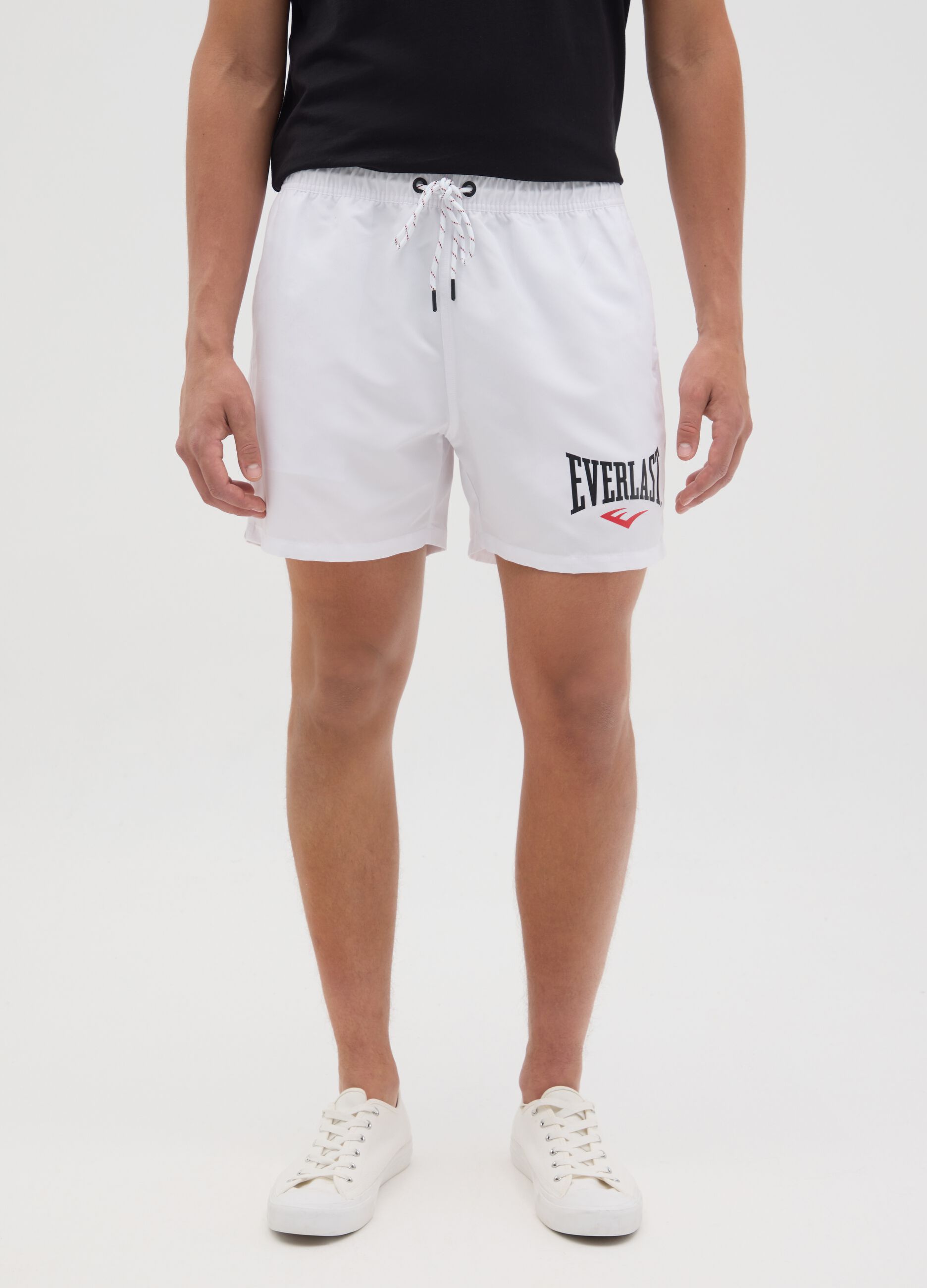 White swimming trunks with logo print