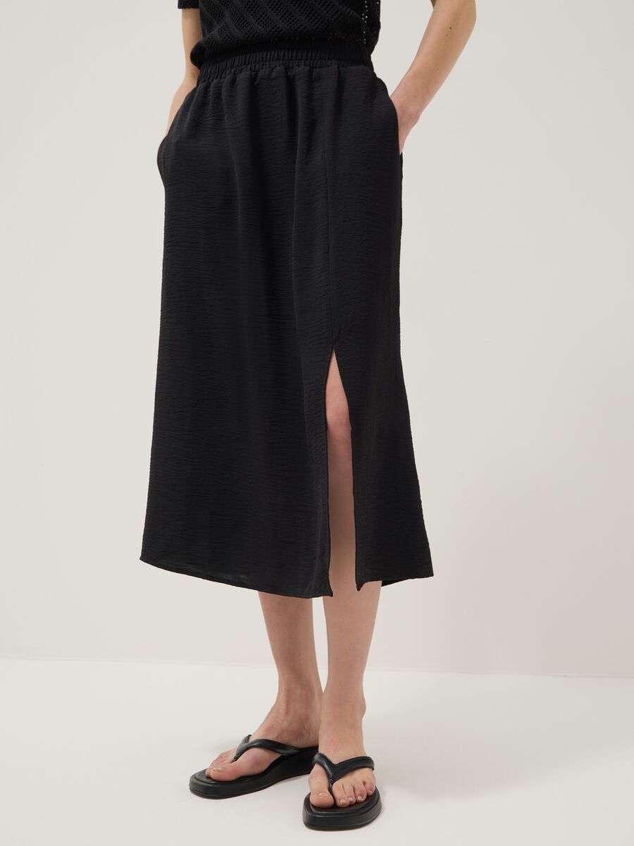 Black long skirt with regular fit, elasticated waist and slit_3