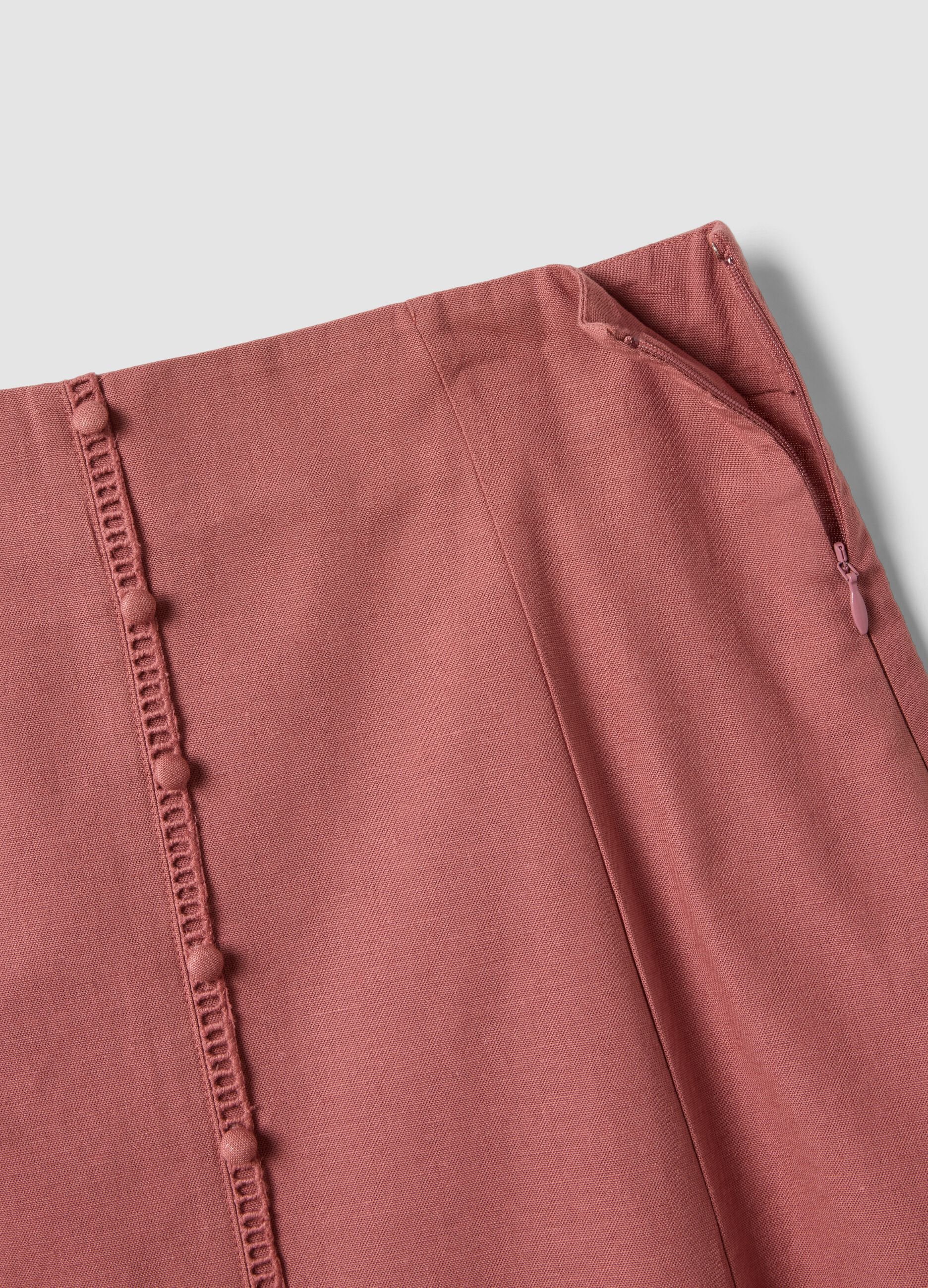 Pink cotton-linen blend skirt with openwork detailing