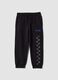 Pantaloni jogger neri in puro cotone con stampa a scacchi_0