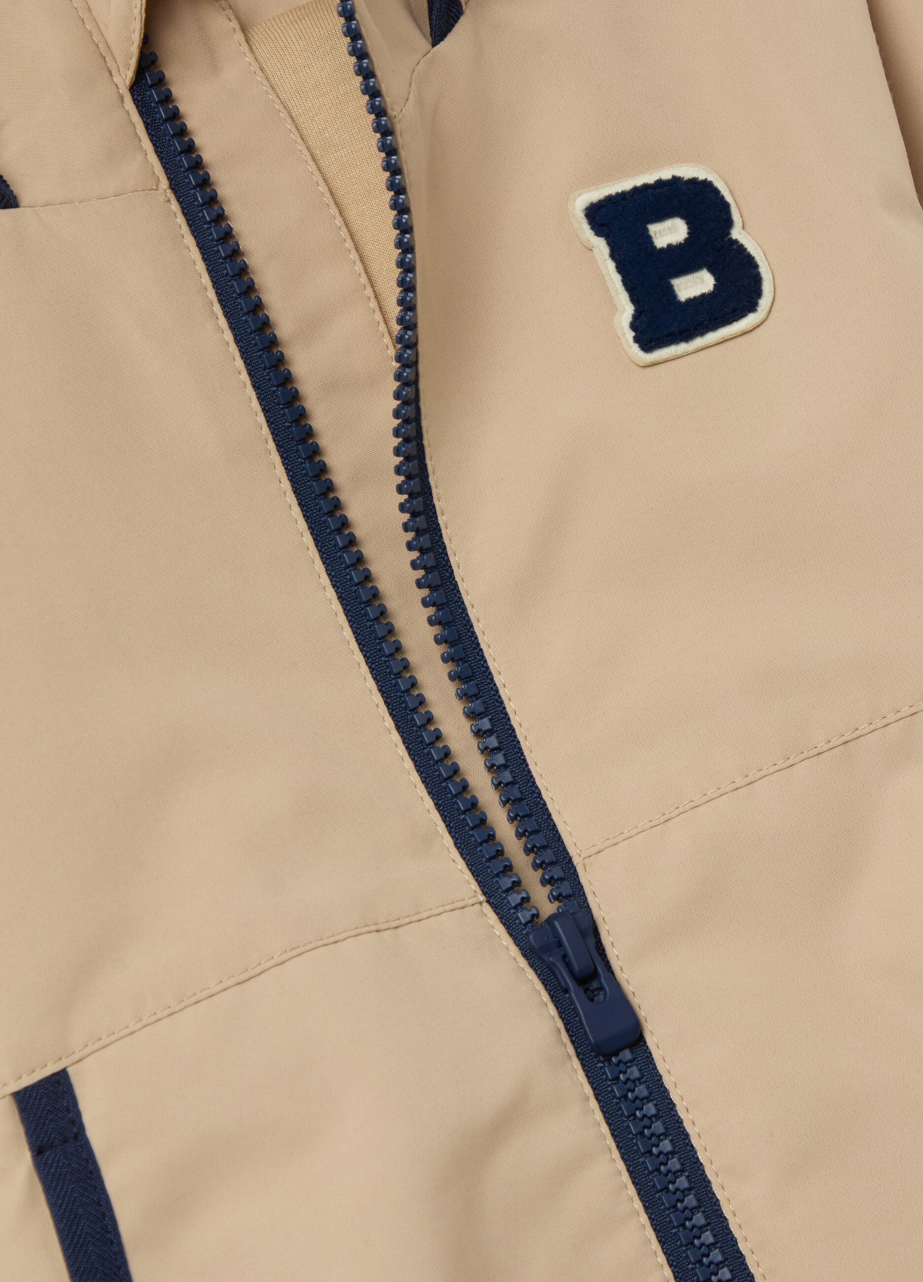 Jacket with hood and contrasting edging