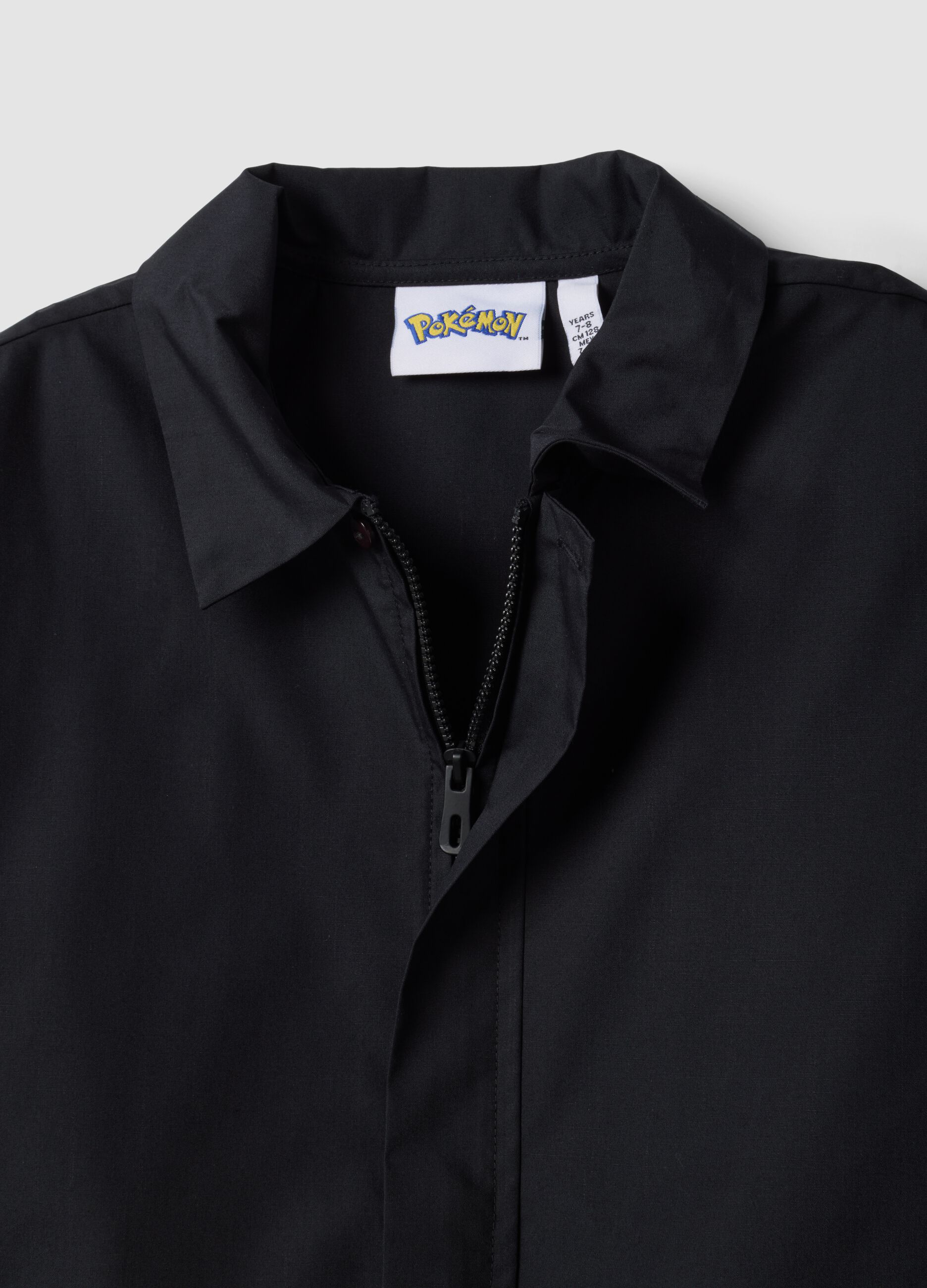 Black zip-up Pok&eacute;mon embroidered school apron for boys