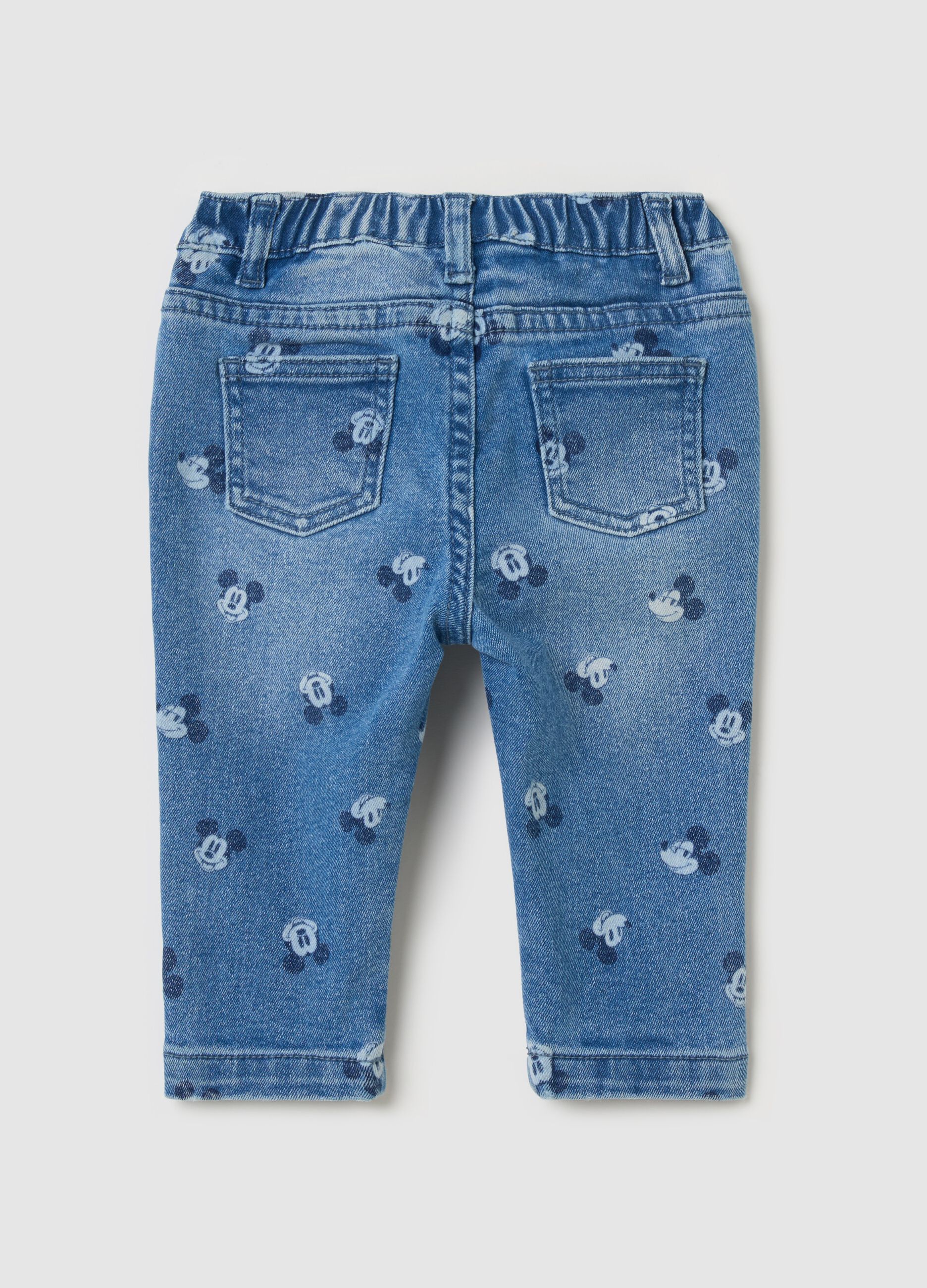 Jeans with all-over Mickey Mouse print