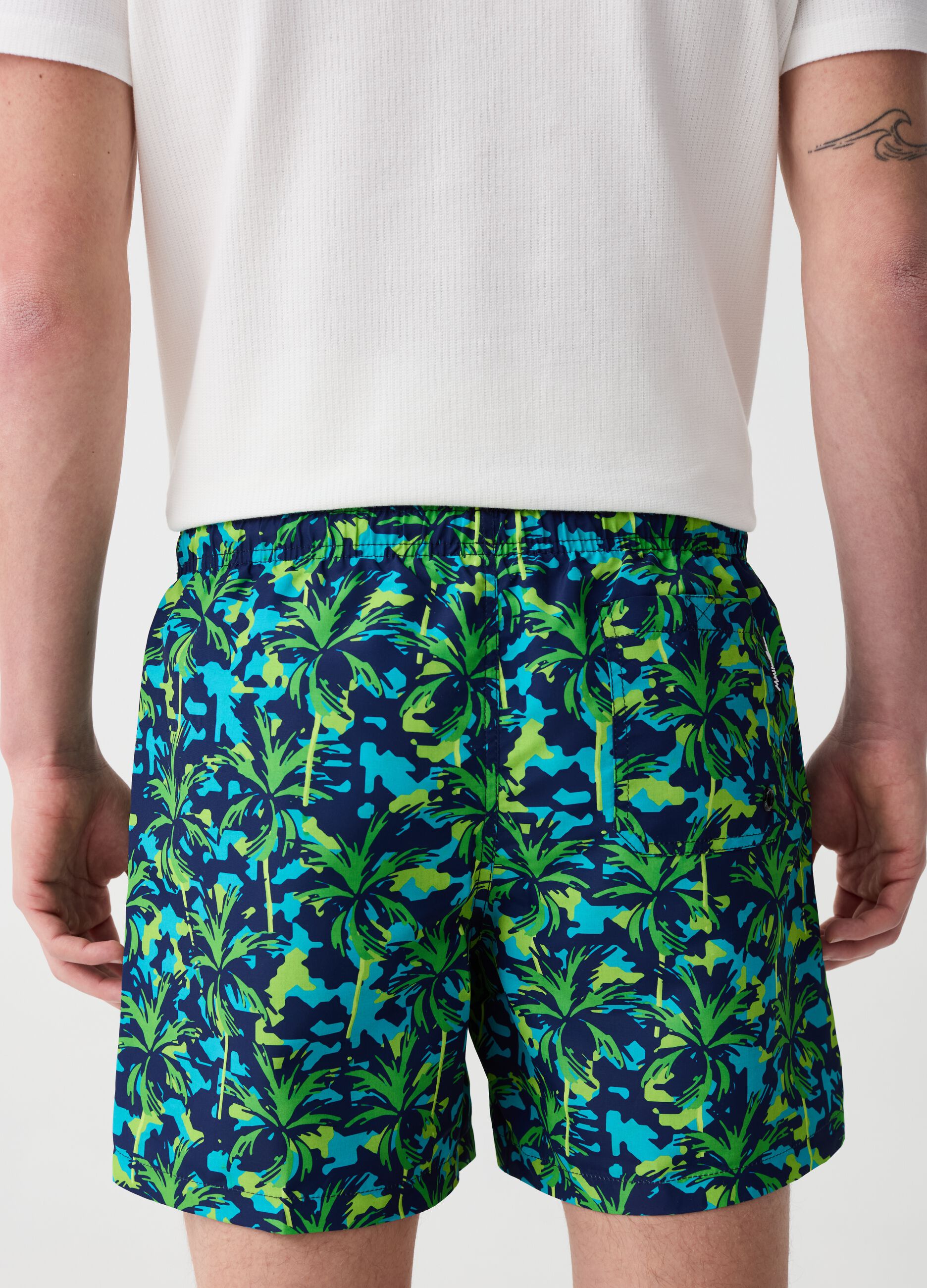 Swimming trunks with palms print