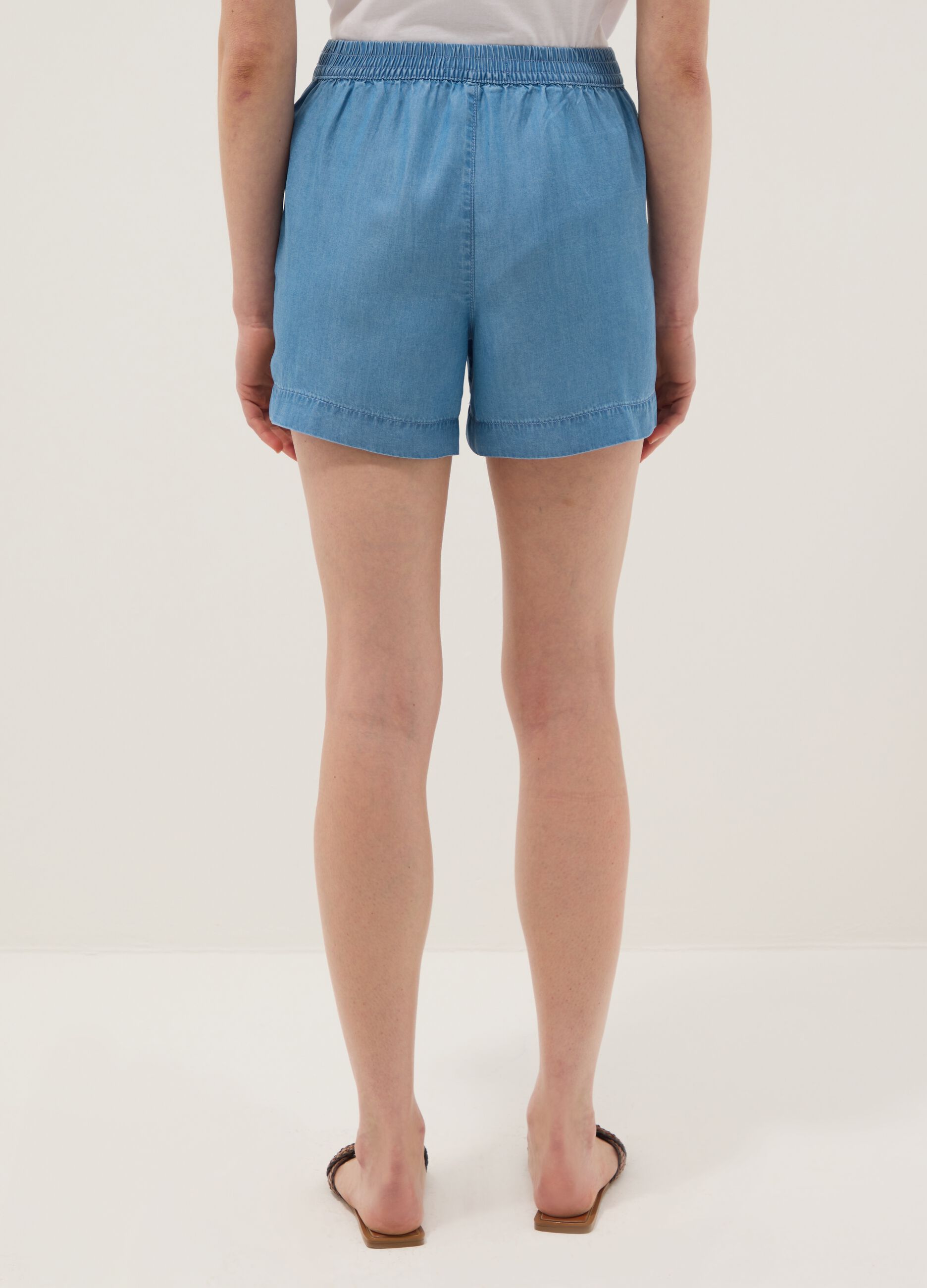 Light blue denim shorts in pure lyocell with elasticated waist, regular fit