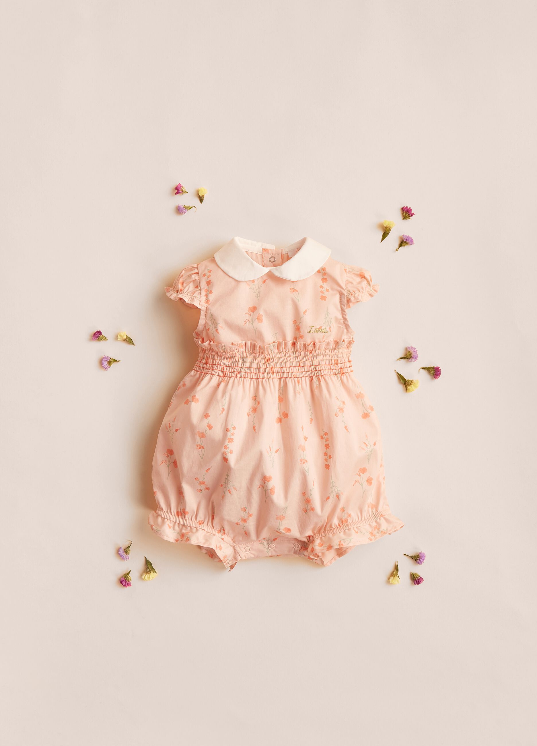 IANA stretch cotton romper suit with floral print.