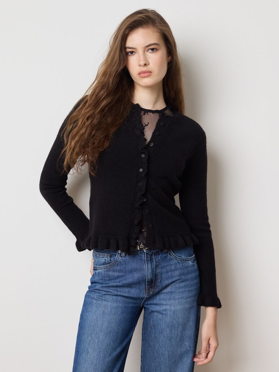 Cardigan nero con volant in misto materiali_1