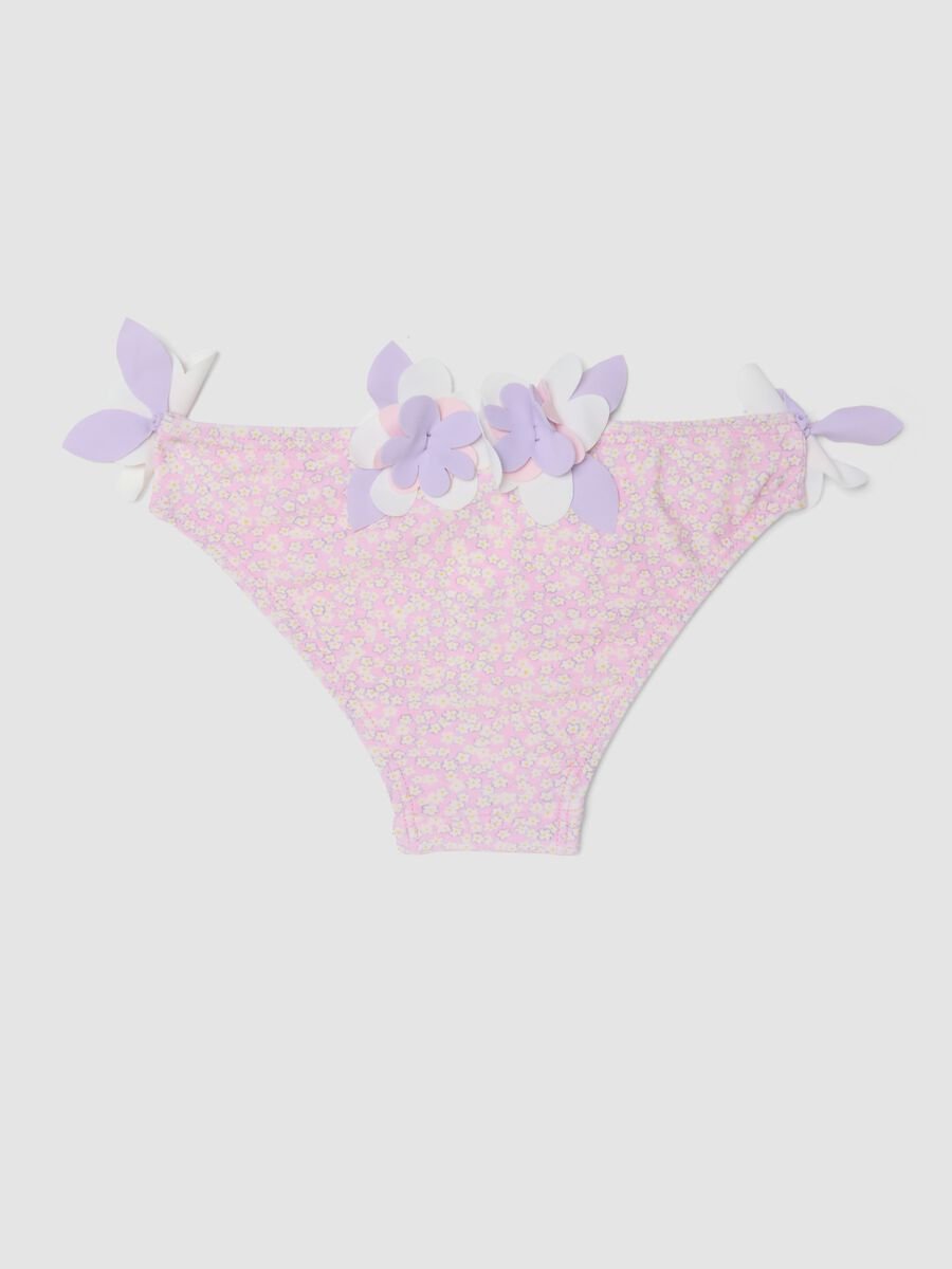 Pink stretch swim briefs with applied floral details_1