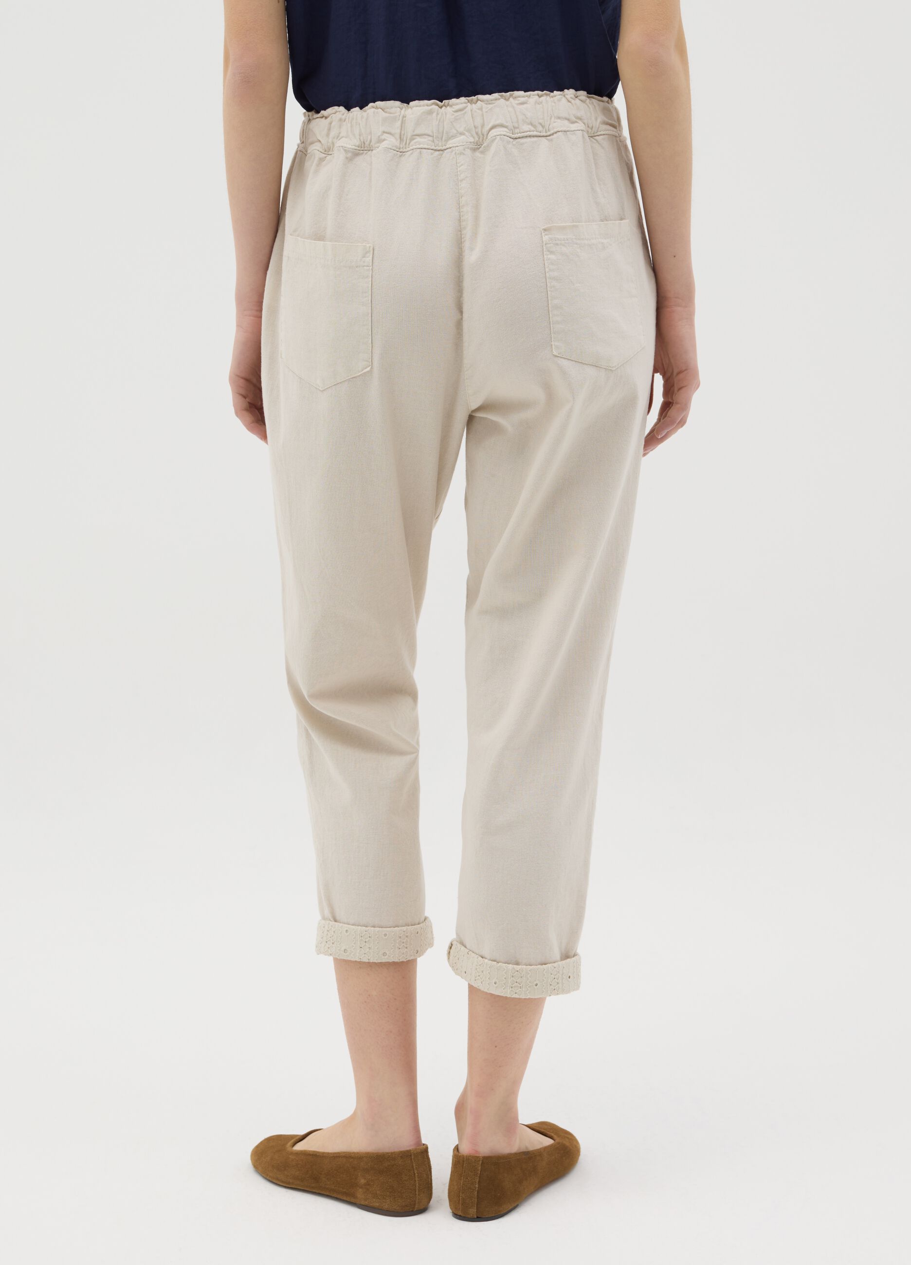 Beige trousers with drawstring and broderie anglaise details