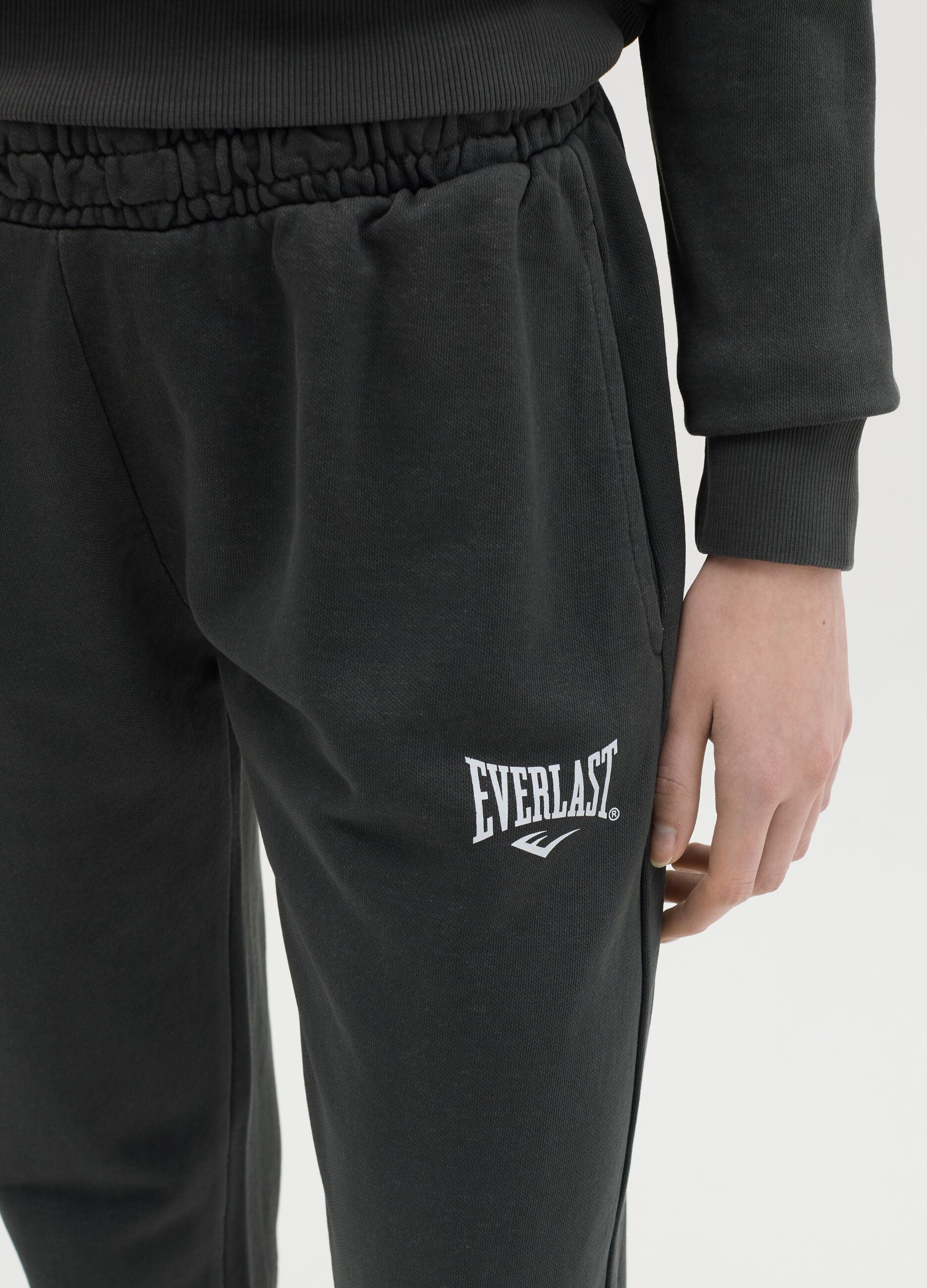 Black joggers with elasticated edging and logo print