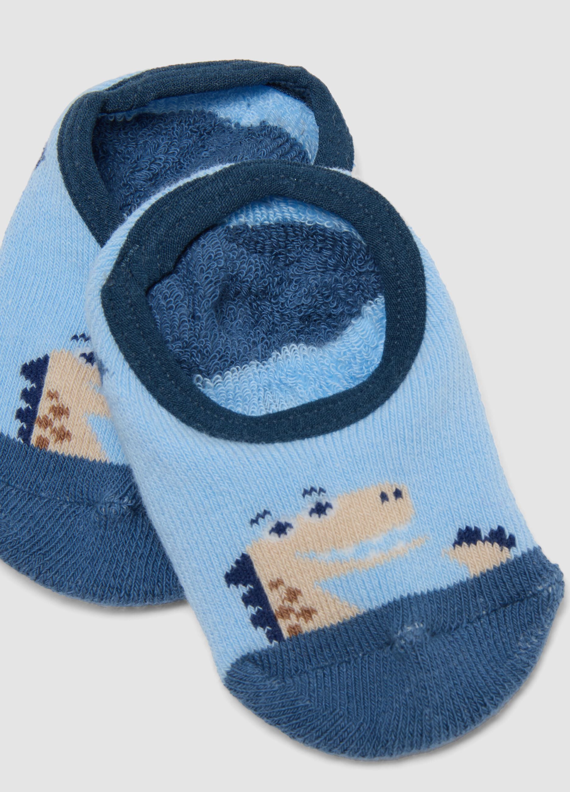 Calze antiscivolo azzurre in cotone organico elasticizzato con dinosauro