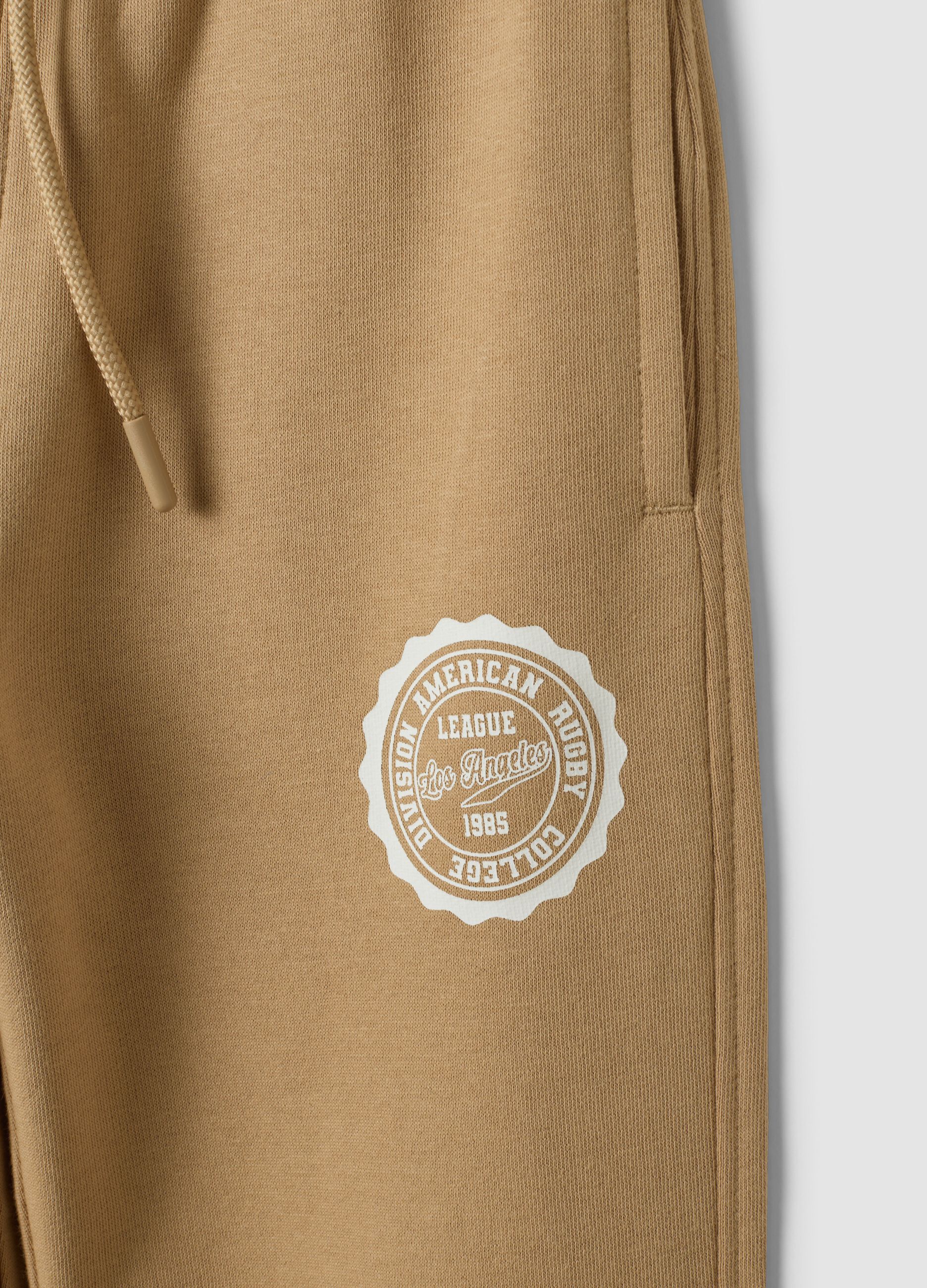 Beige cotton-viscose blend joggers with contrasting print for boys