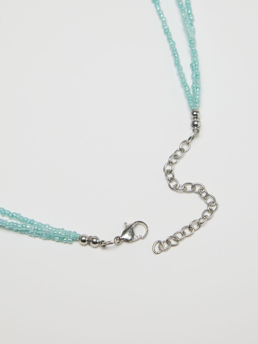 Multi-strand necklace with light blue beads_1