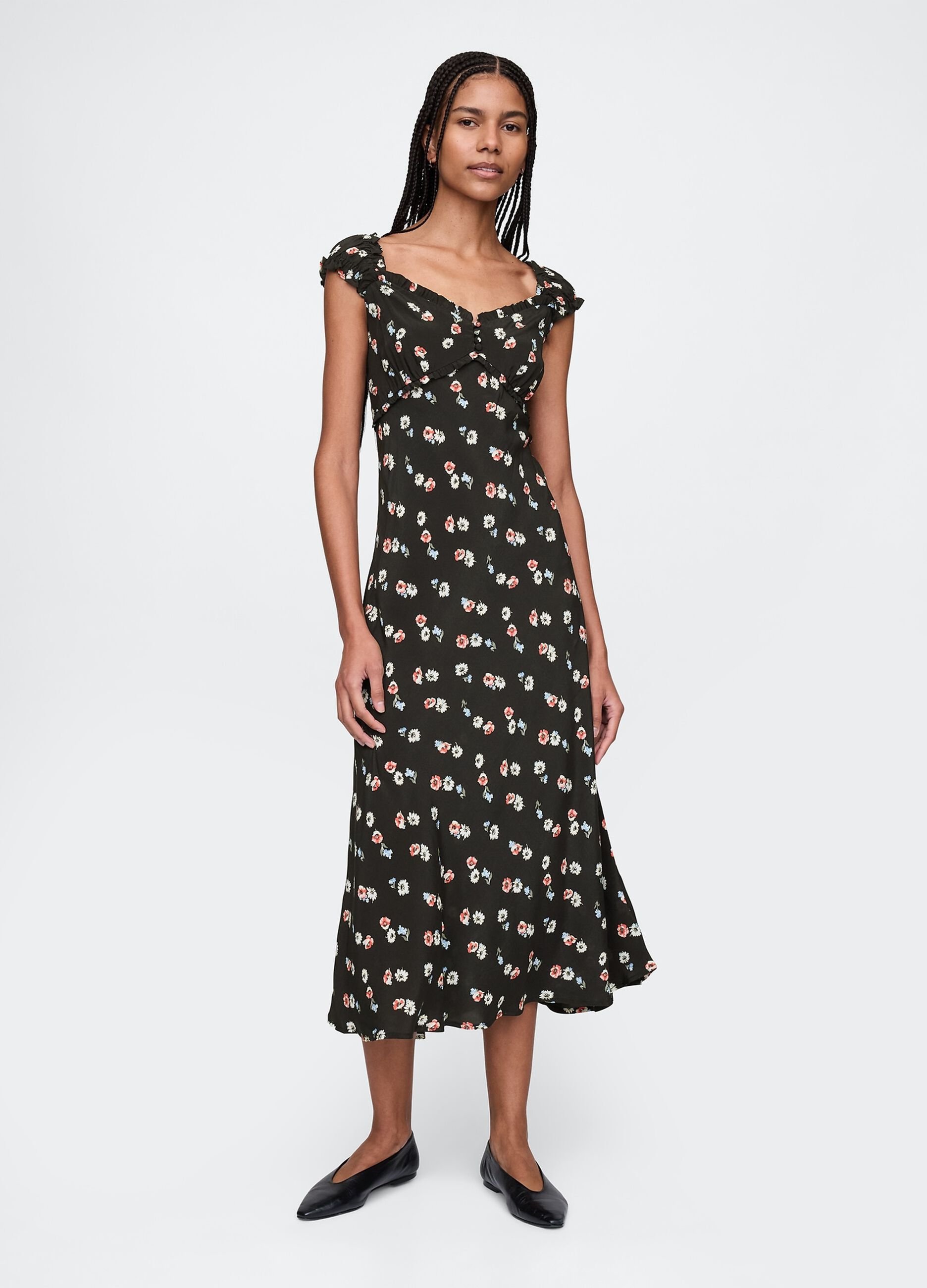 Sleeveless dress with floral pattern