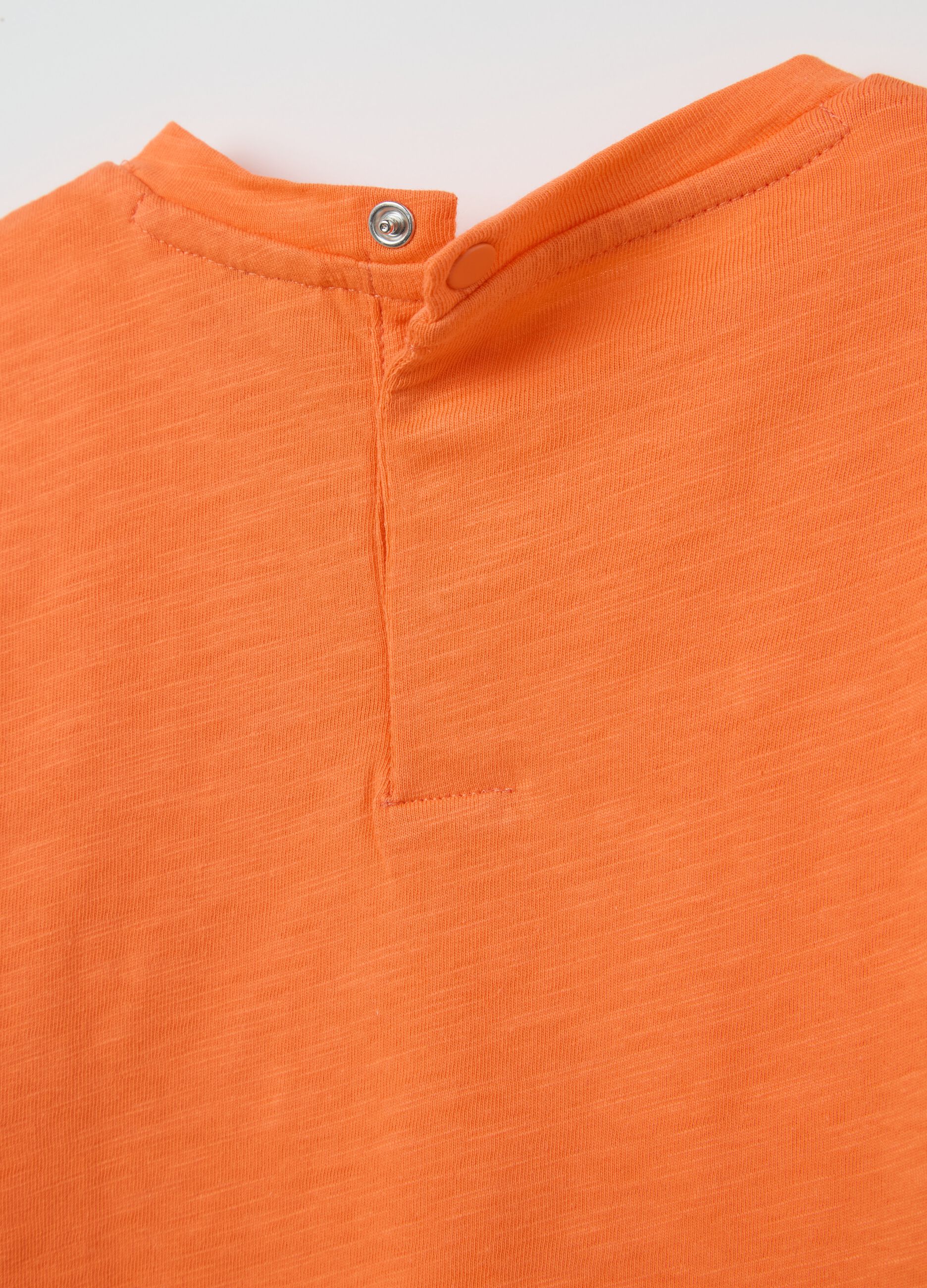 Orange T-shirt in organic cotton with pocket