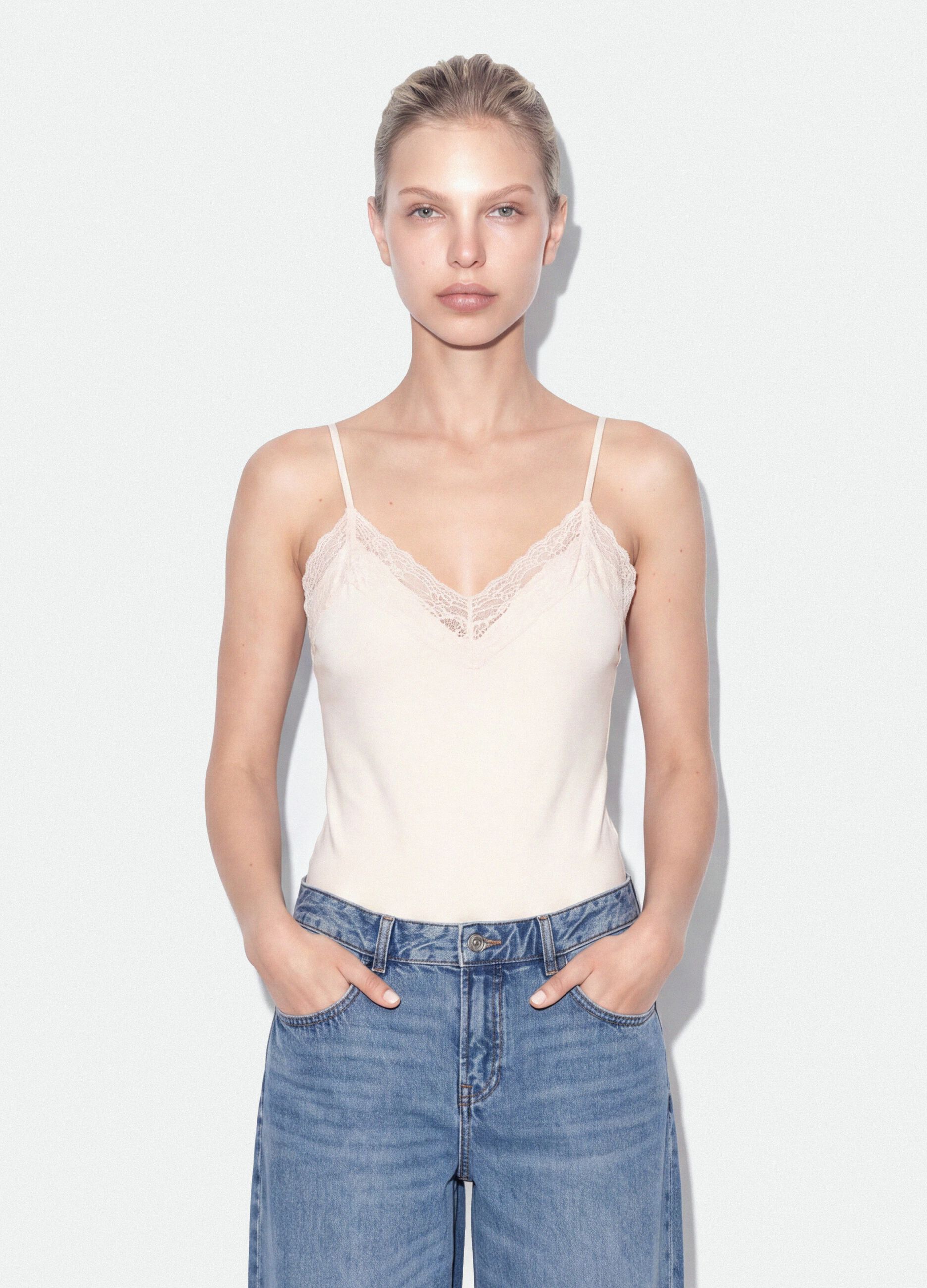 White fitted stretch-cotton bodysuit with lace
