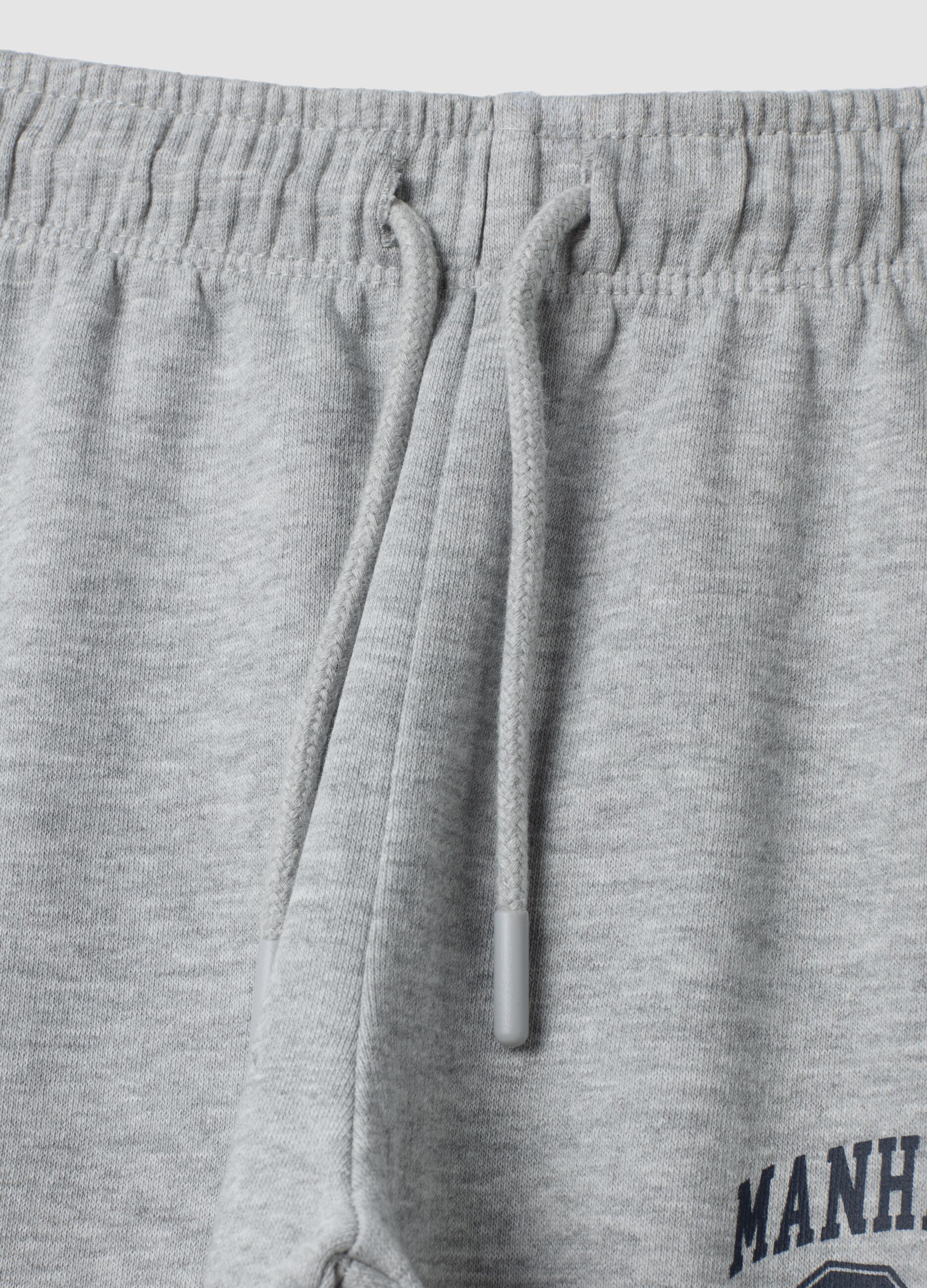 Pantaloni jogger grigi in puro cotone con stampa