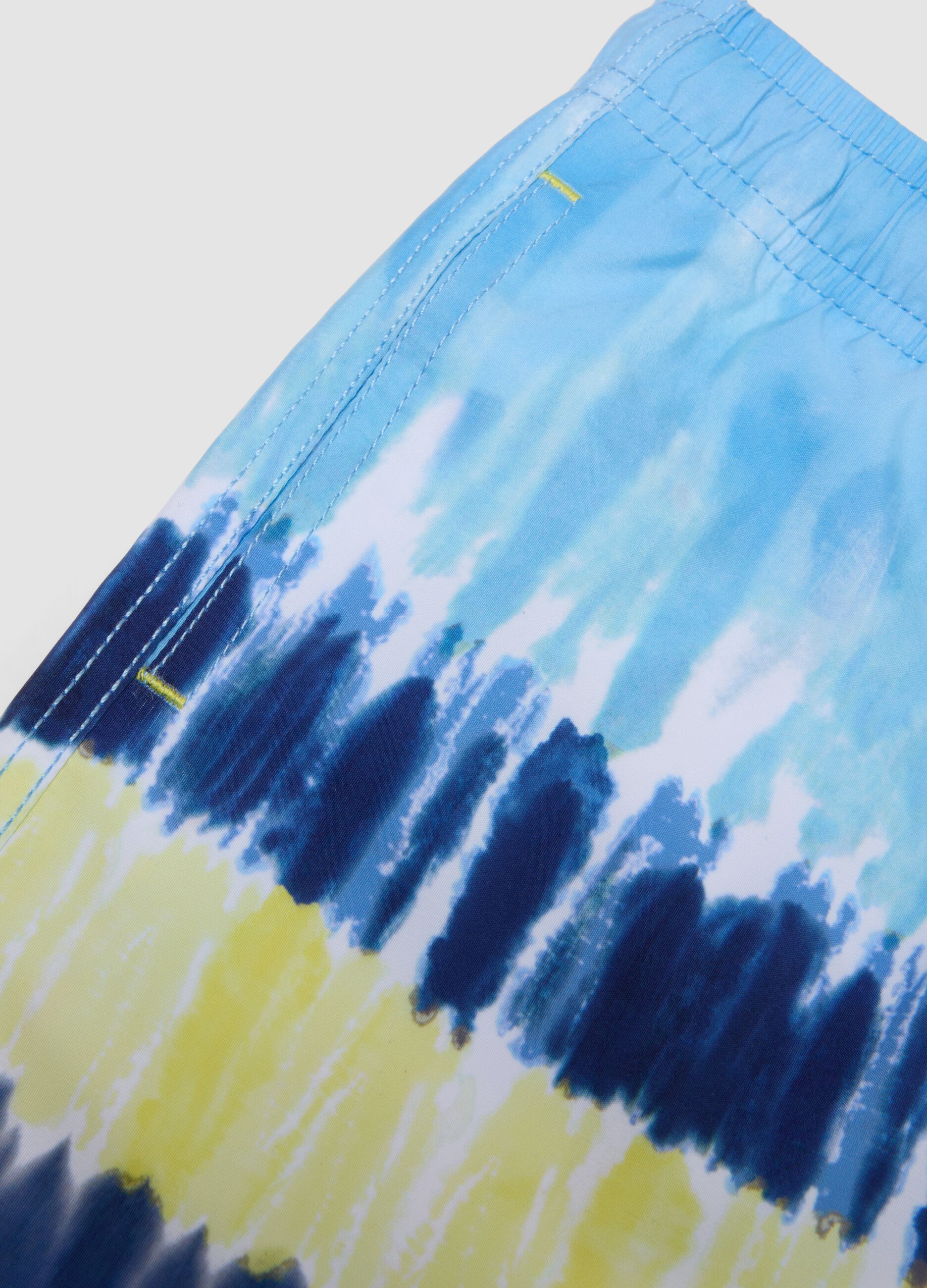 Blue tie-dye swim shorts with drawstring