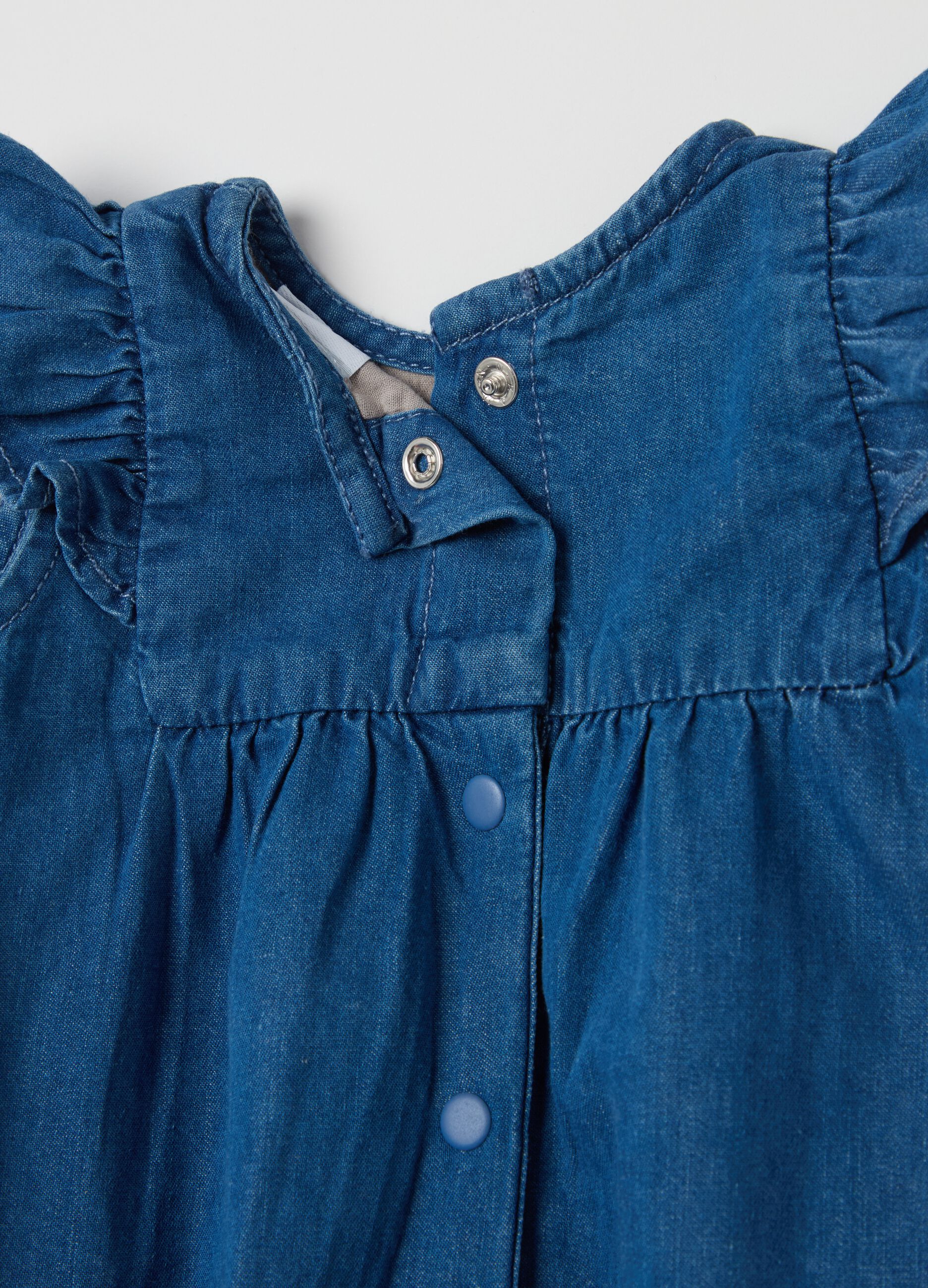 Denim romper suit with floral embroidery