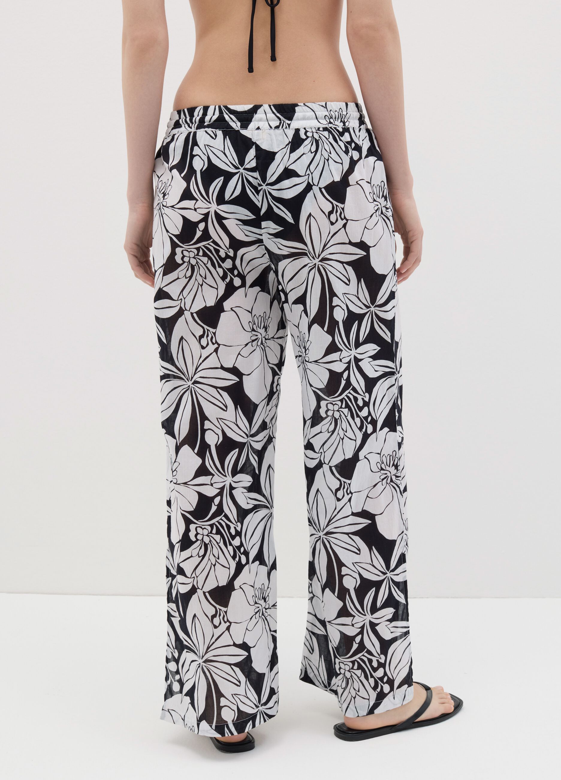 Pantalone lungo copricostume a fiori in cotone
