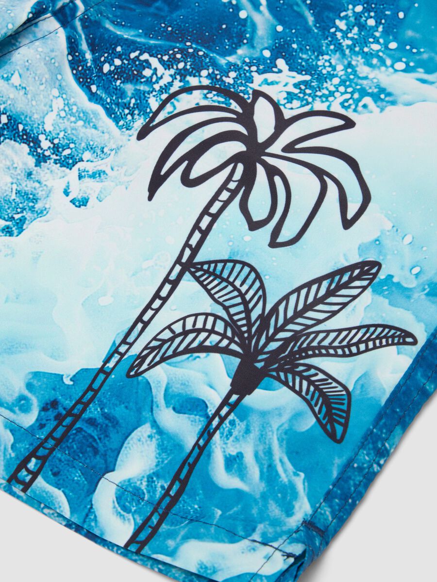 Blue boys&rsquo; swim shorts with wave and palm print_3