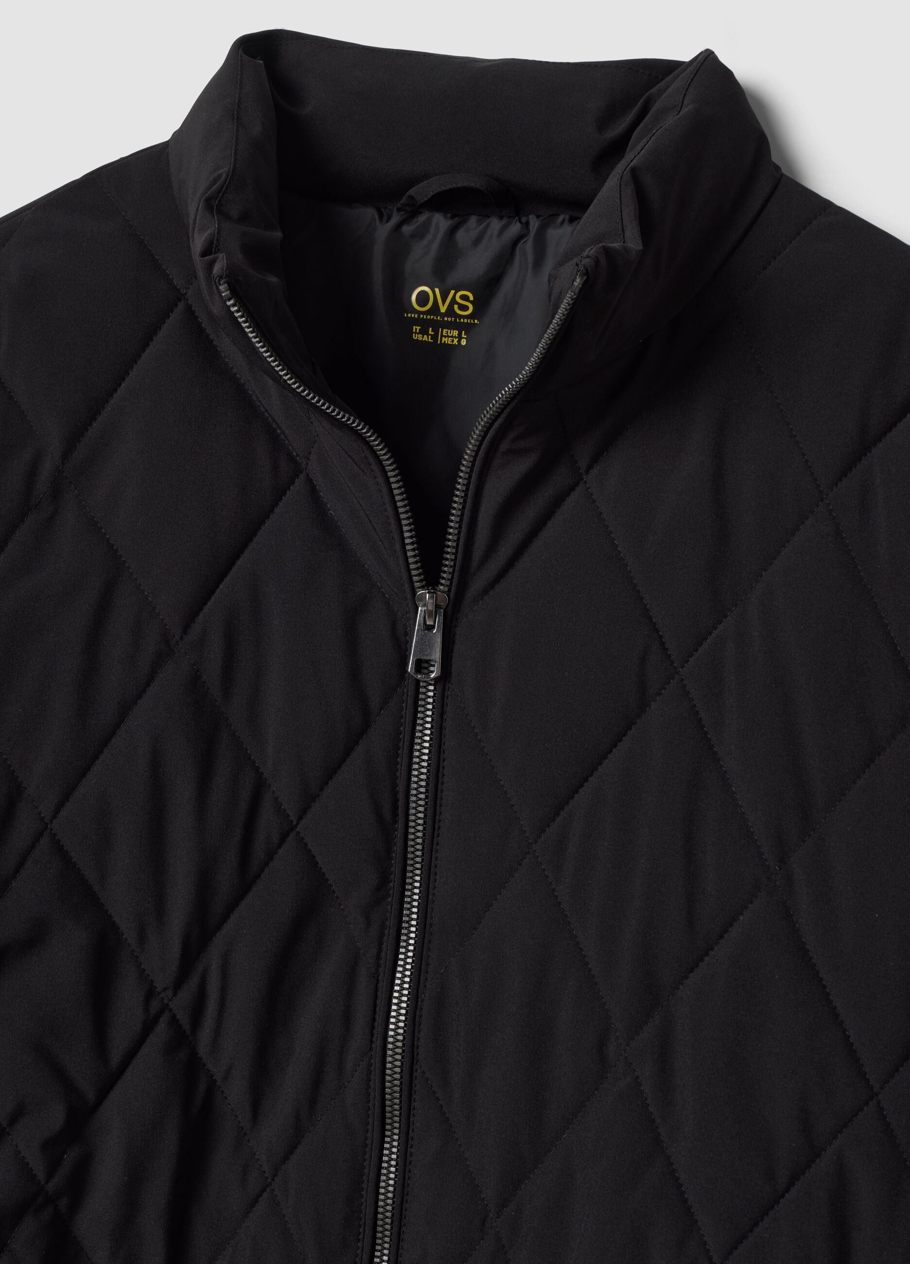 Giacca nera in tessuto elasticizzato con zip