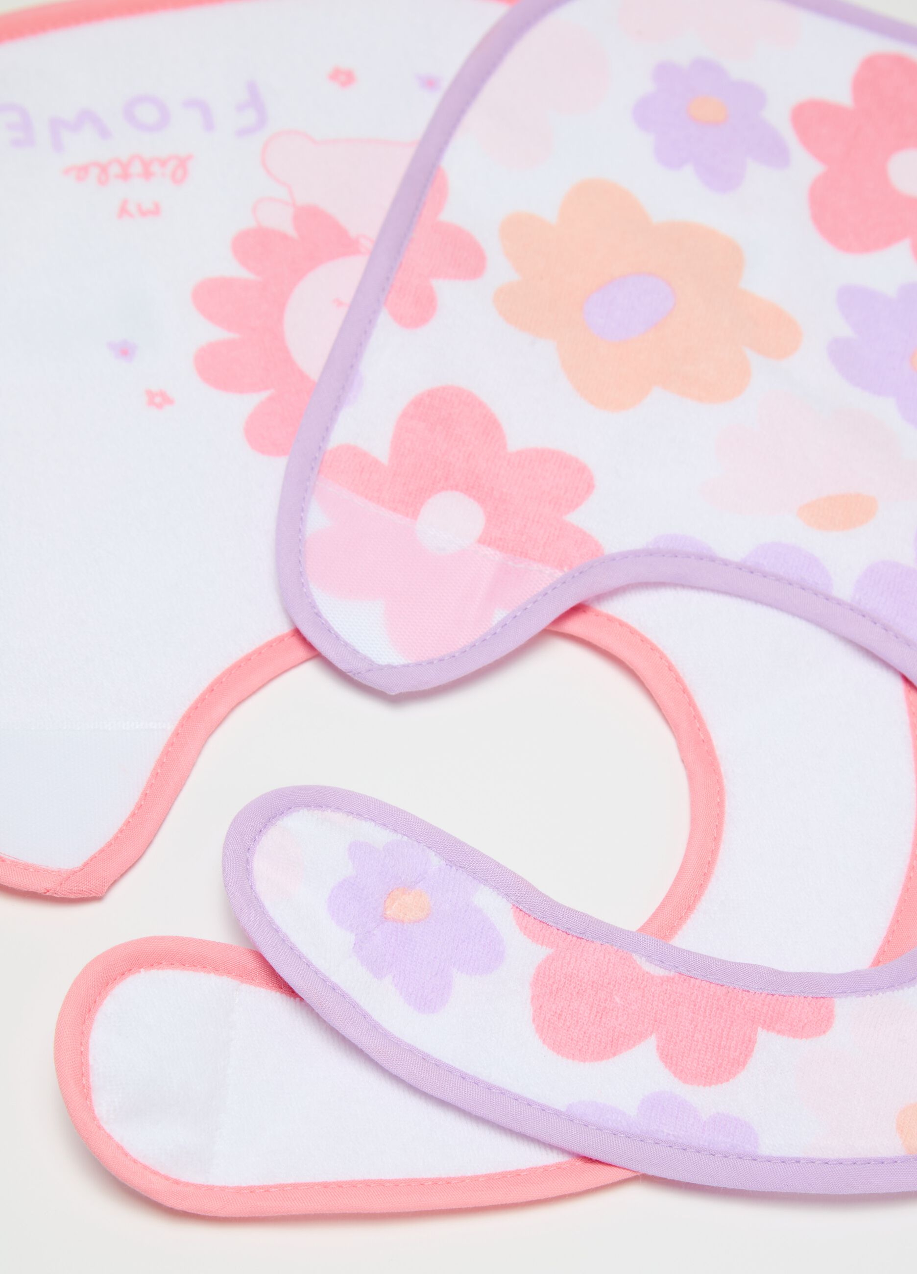 Two-pack bibs with PEVA backing and flowers print
