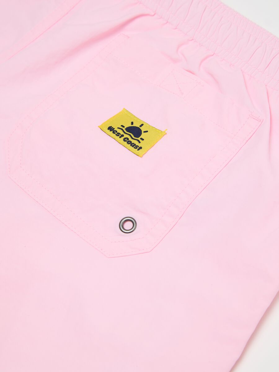 Pink swim trunks in mixed materials_5
