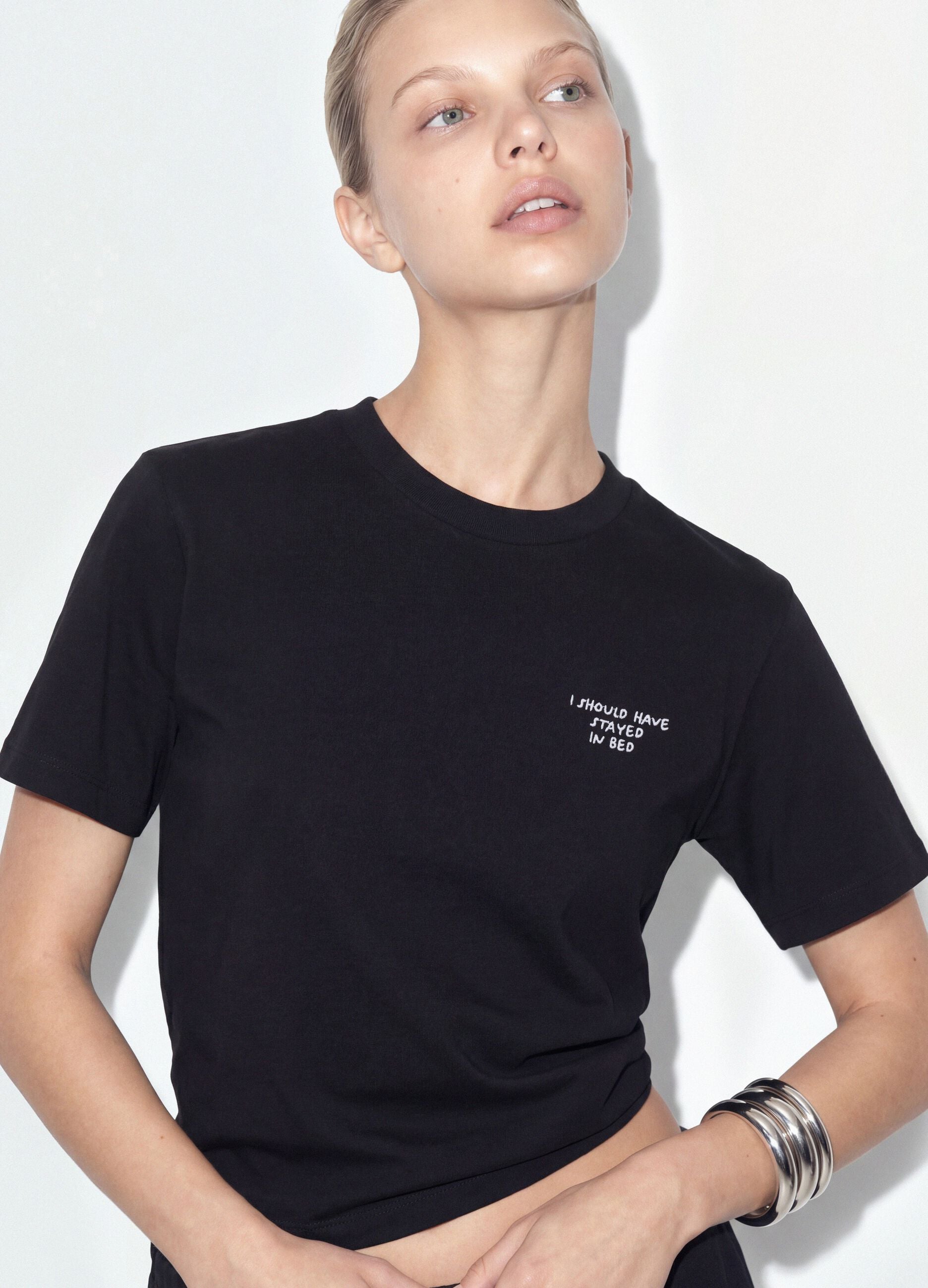 Black relaxed-fit pure cotton T-shirt with embroidered slogan
