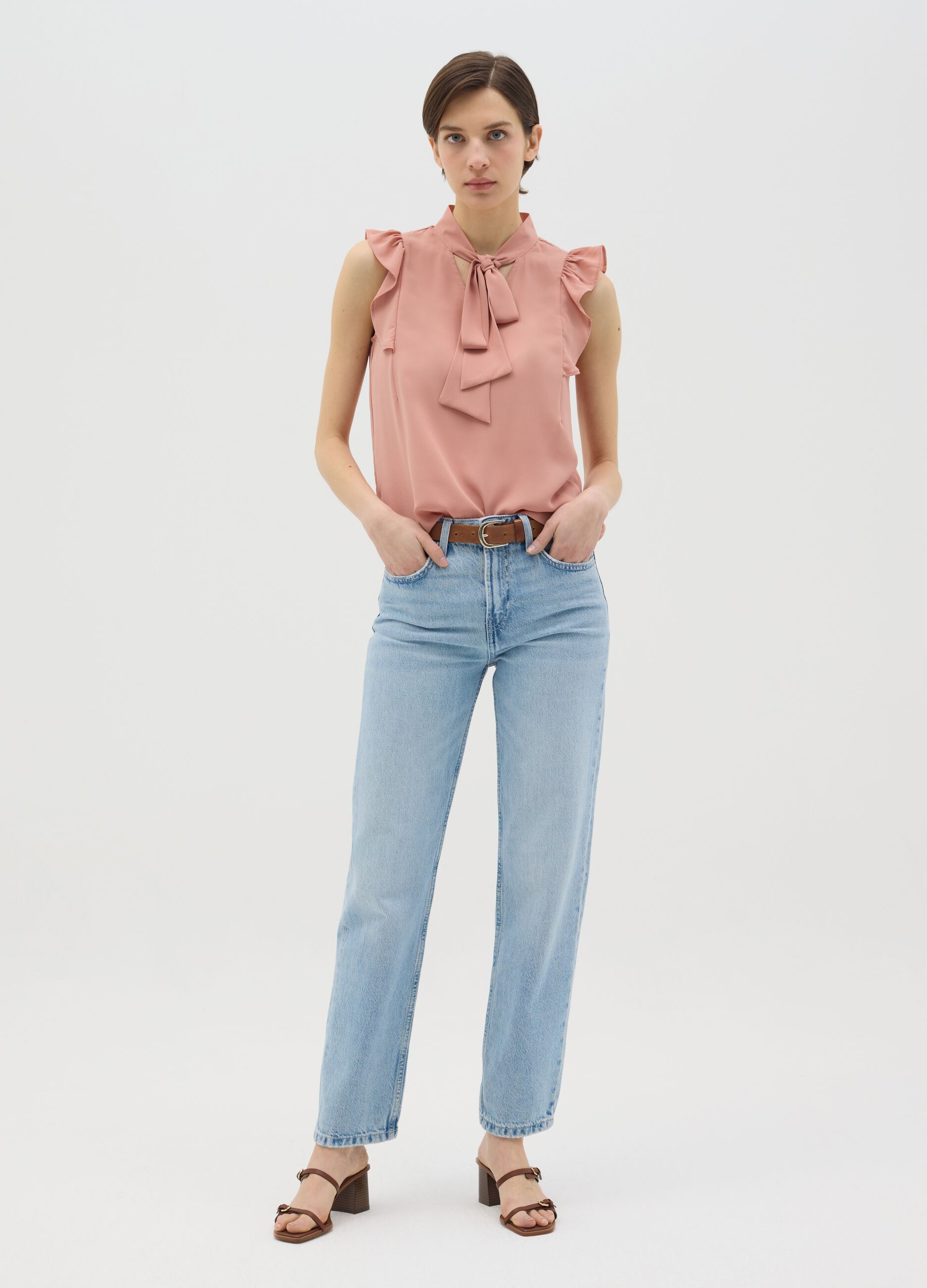 Pink sleeveless blouse with flounce