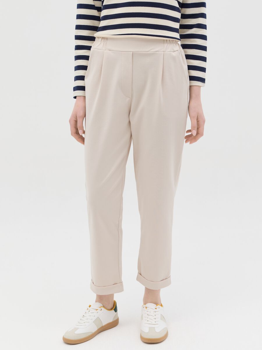 Beige cropped trousers with turn-ups_1