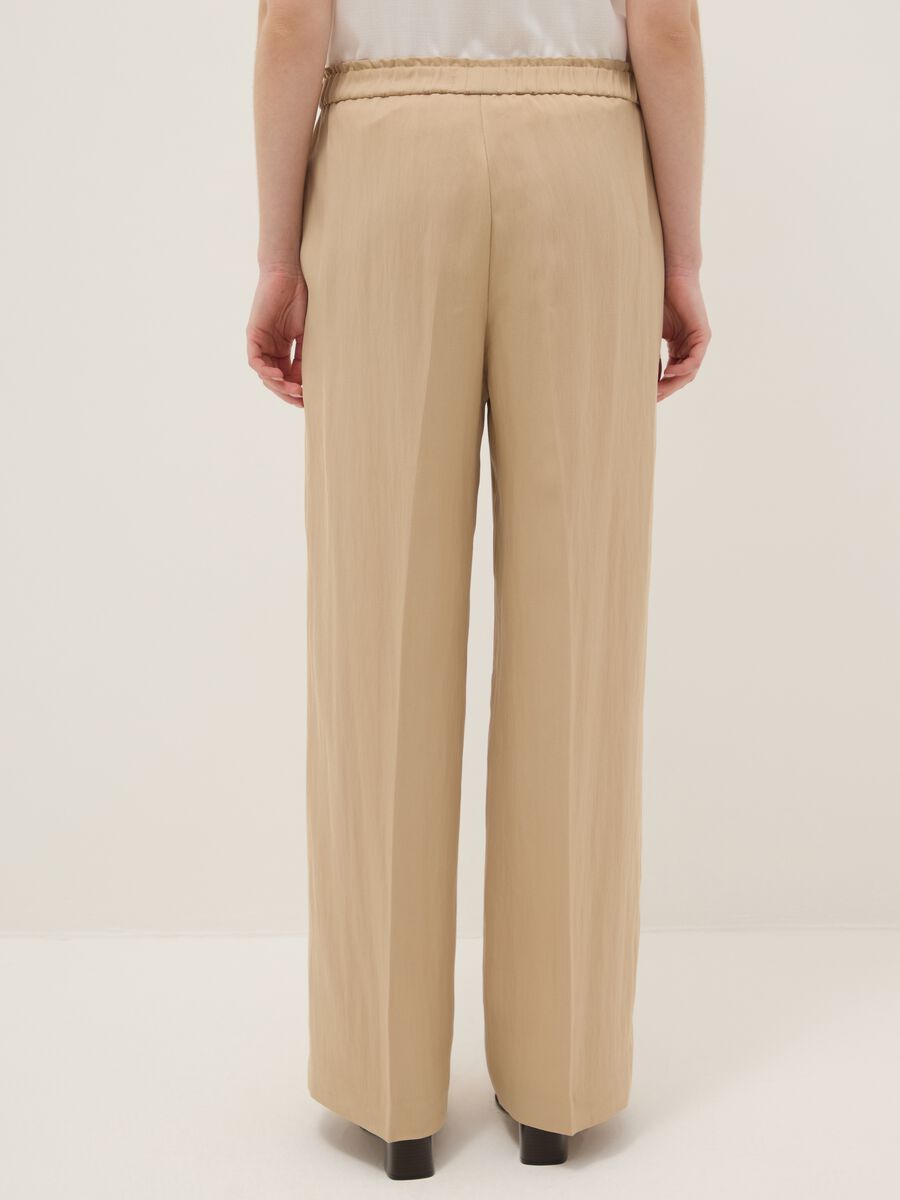 Beige wide leg jogger trousers in Lyocell and viscose blend_3
