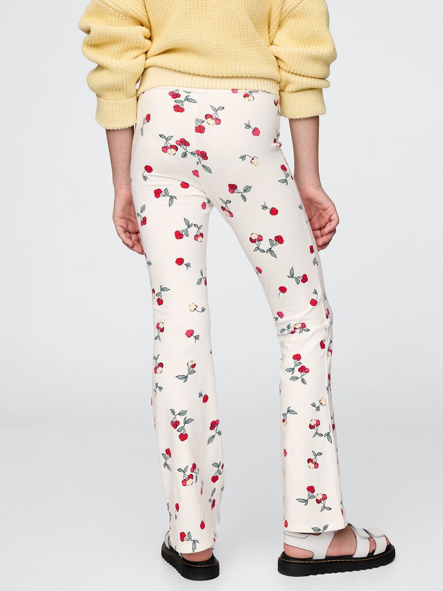 Flared trousers with floral pattern on white background_2