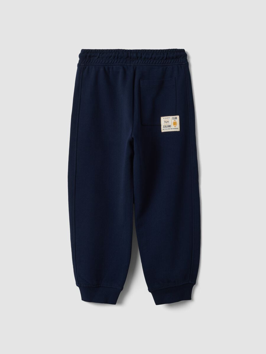 Pantaloni jogger blu in puro cotone con vita elasticizzata per bambino_1