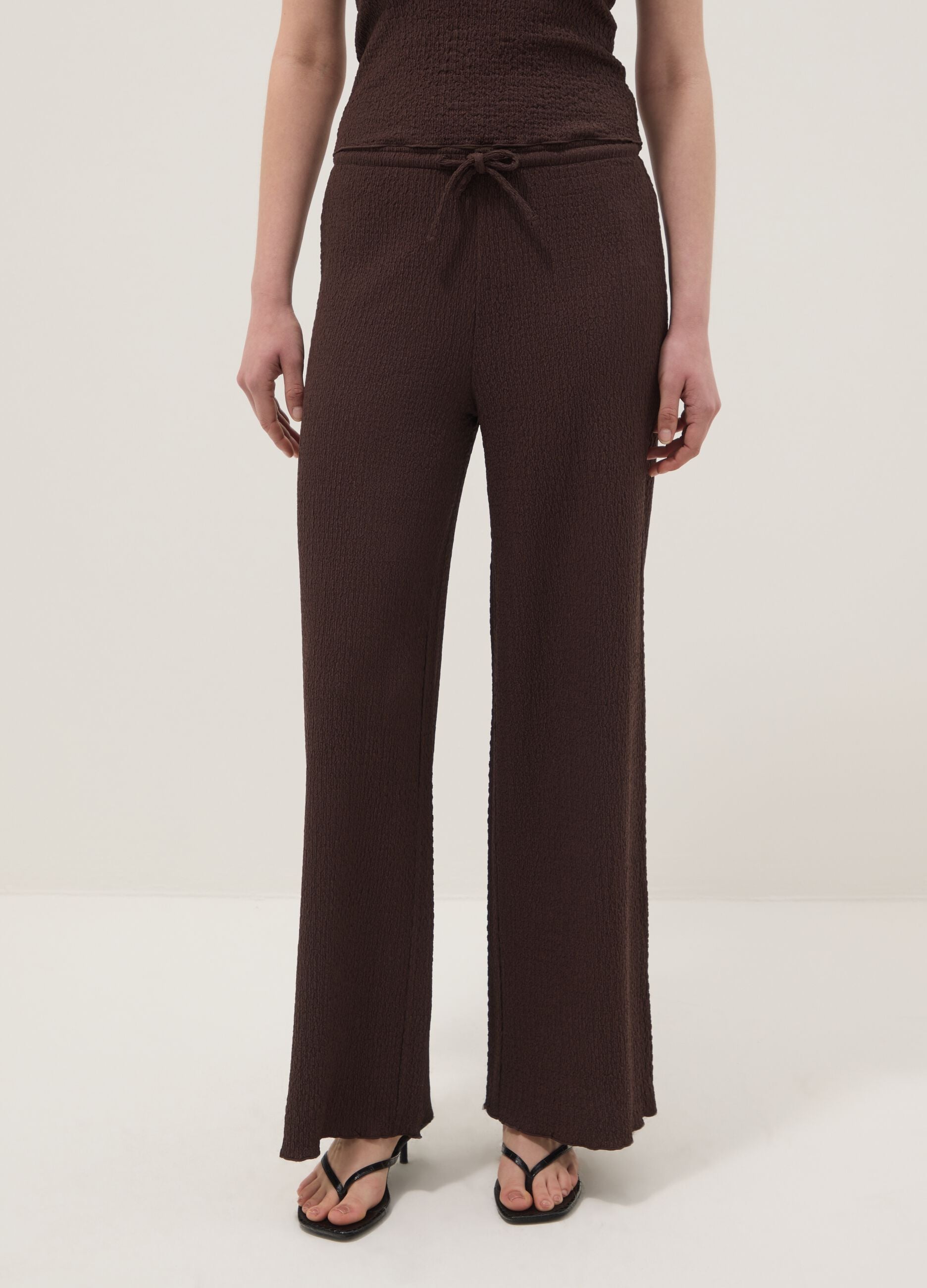 Brown stretch wide-leg trousers with crinkled texture