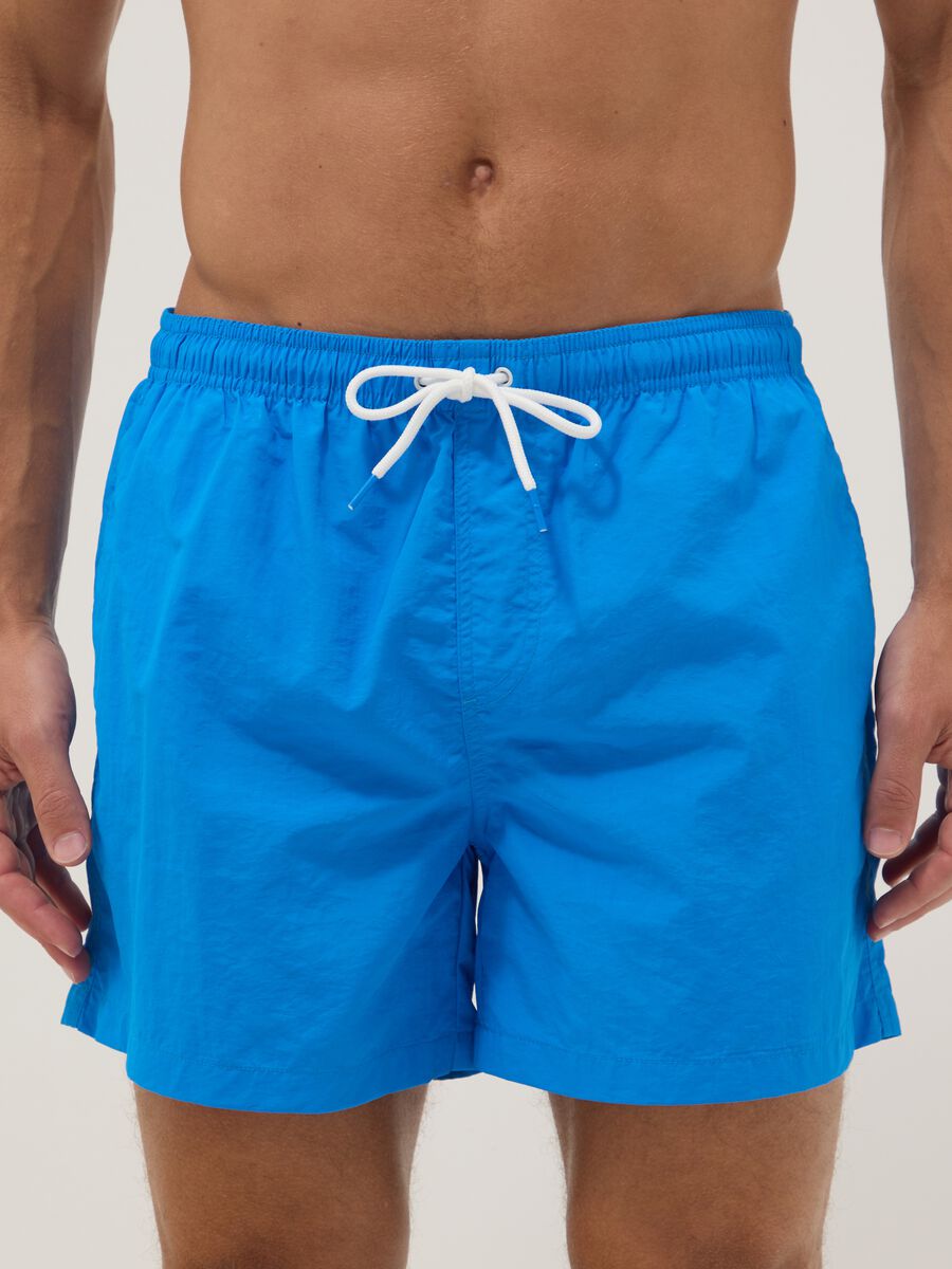 Blue swim shorts with elasticated waistband_1