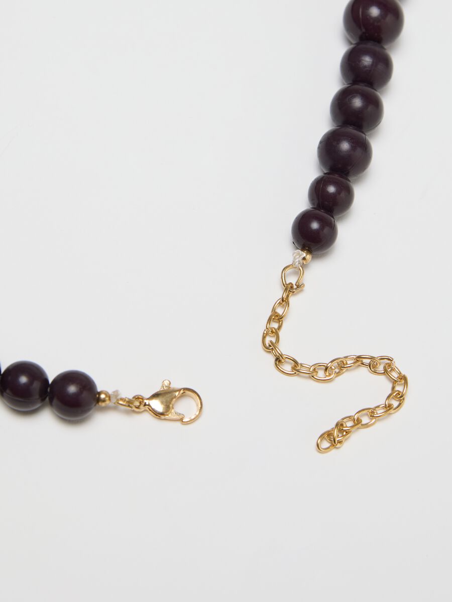 Black necklace with pearls and strands of beads_1